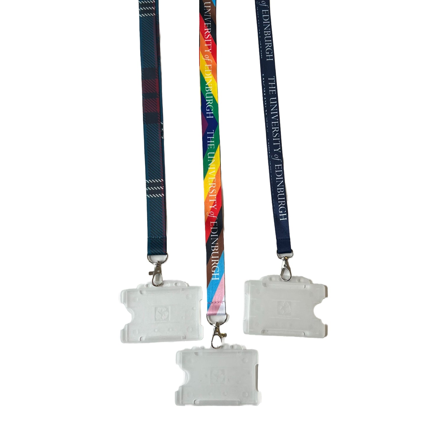 All three lanyards in image. From left to right: University Tartan Lanyard, Recycled Progress Rainbow Lanyard and Navy lanyard.