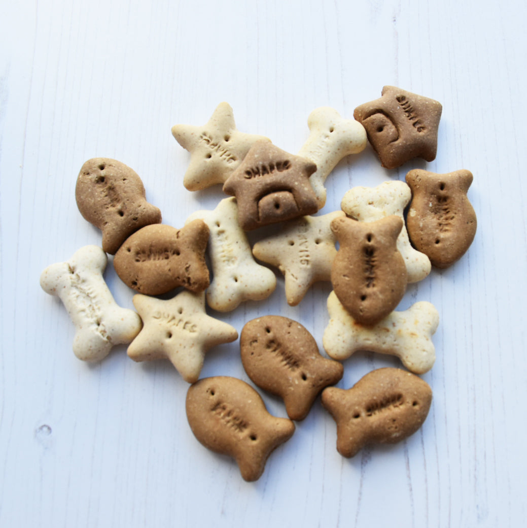 University Dog Biscuits shown scattered in heart shape.