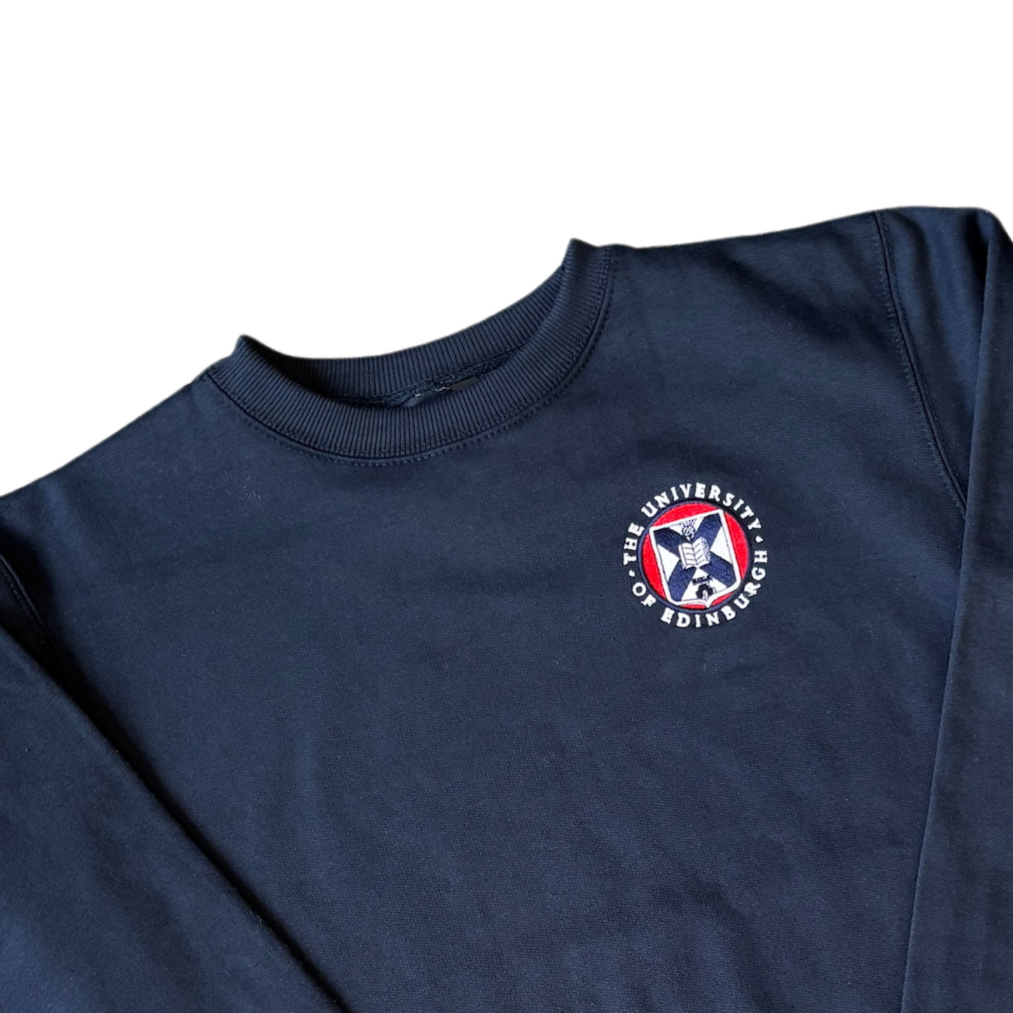 Navy crew neck sweatshirt with the University crest embroidered on the breast in full colour embroidery.