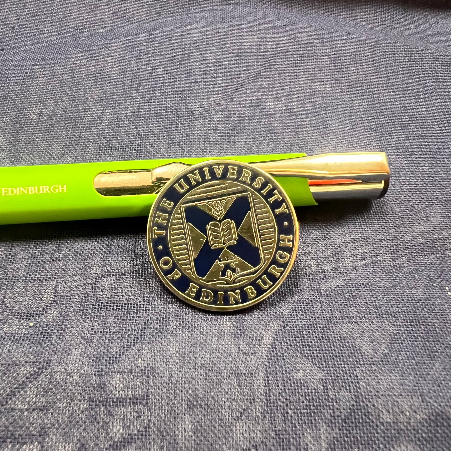 Close of up navy and sliver crest pin badge