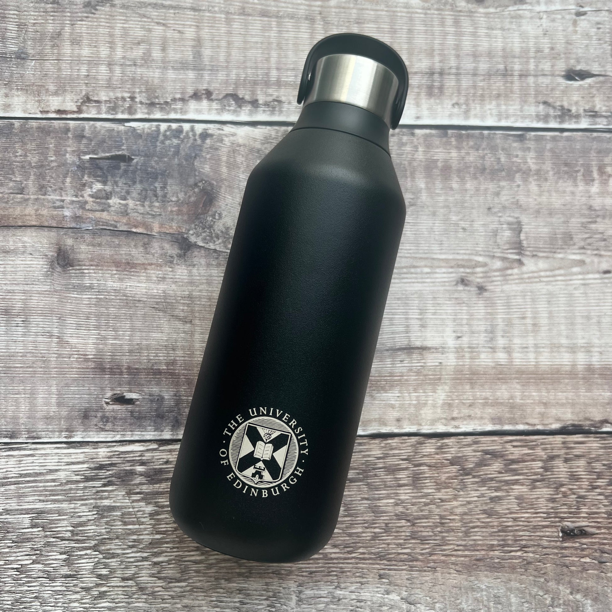 Black chillys bottle with the university crest engraved