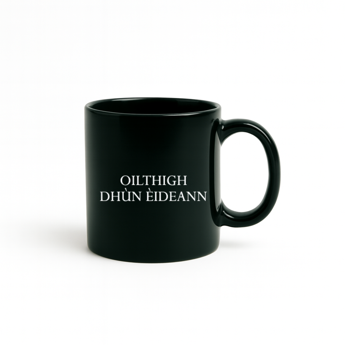 dark green mug with white text reading 'Oilthigh Dhùn Èideann'. Oilthigh Dhùn Èideann means the University of Edinburgh in Scottish Gaelic.
