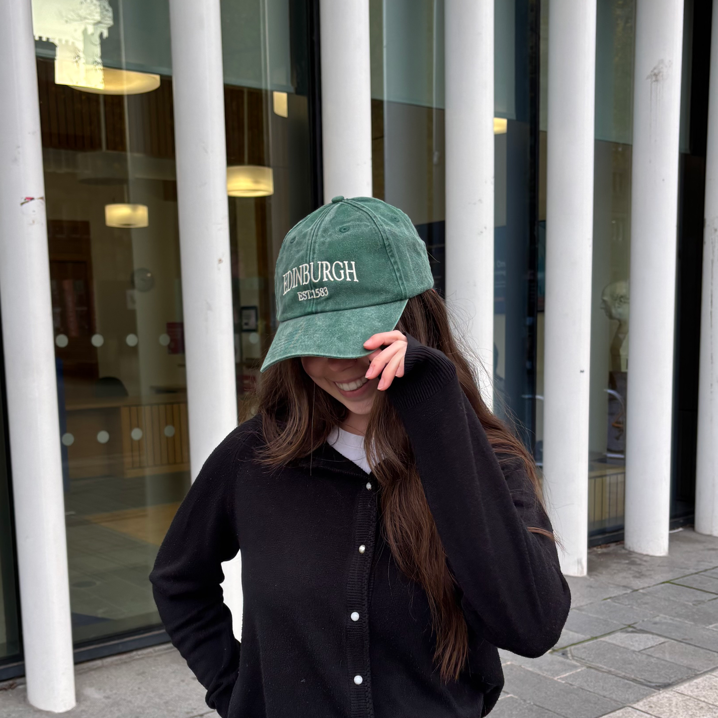 Model wears Vintage Edinburgh Baseball Cap in green.
