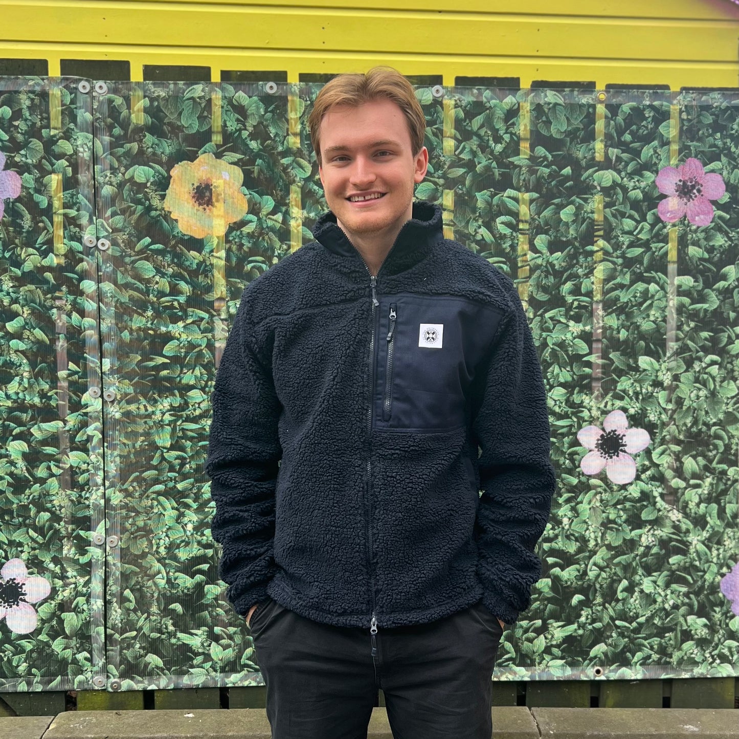 Our model wears the navy fleece jumper in navy.