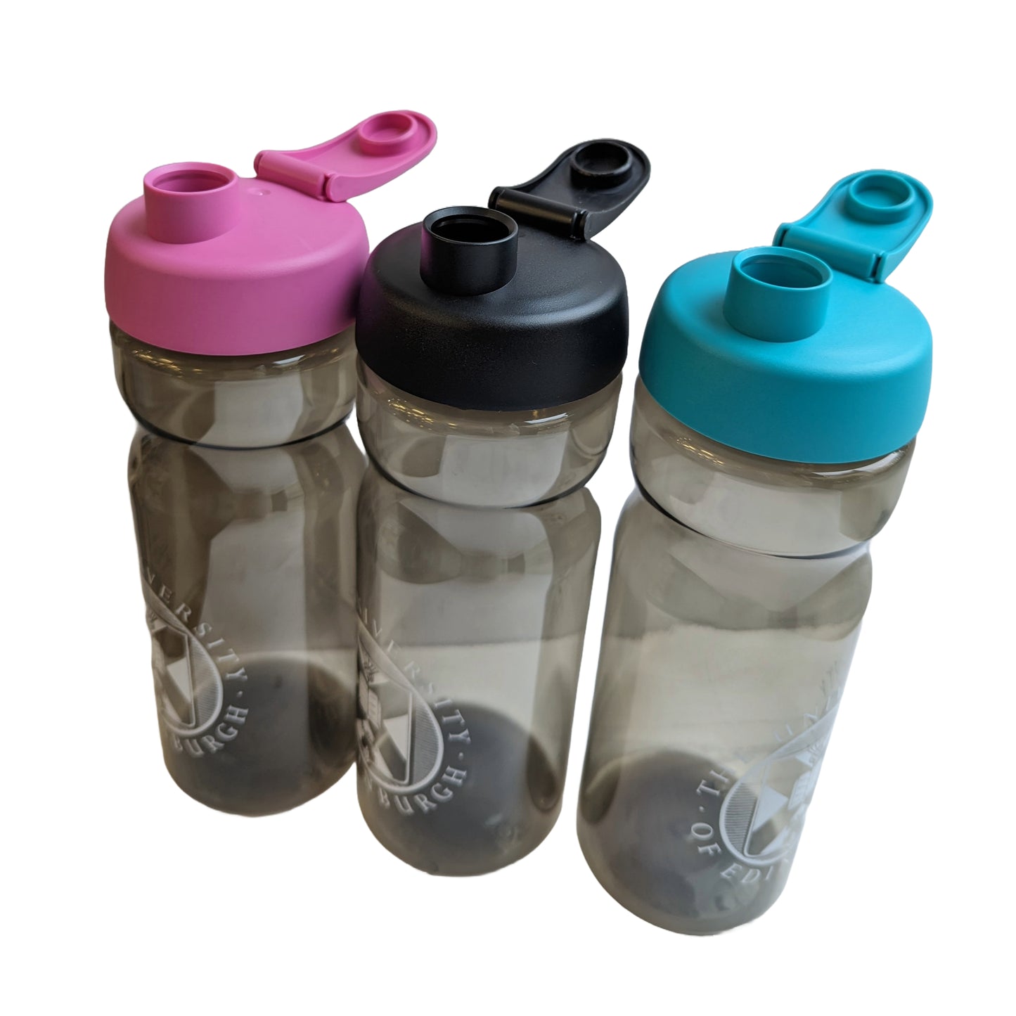 Three dark grey opaque bottles with their lids open. From left to right: water bottle with a pink cap and white logo, bottle with a black cap and white logo, bottle with a blue/teal cap and a white logo.