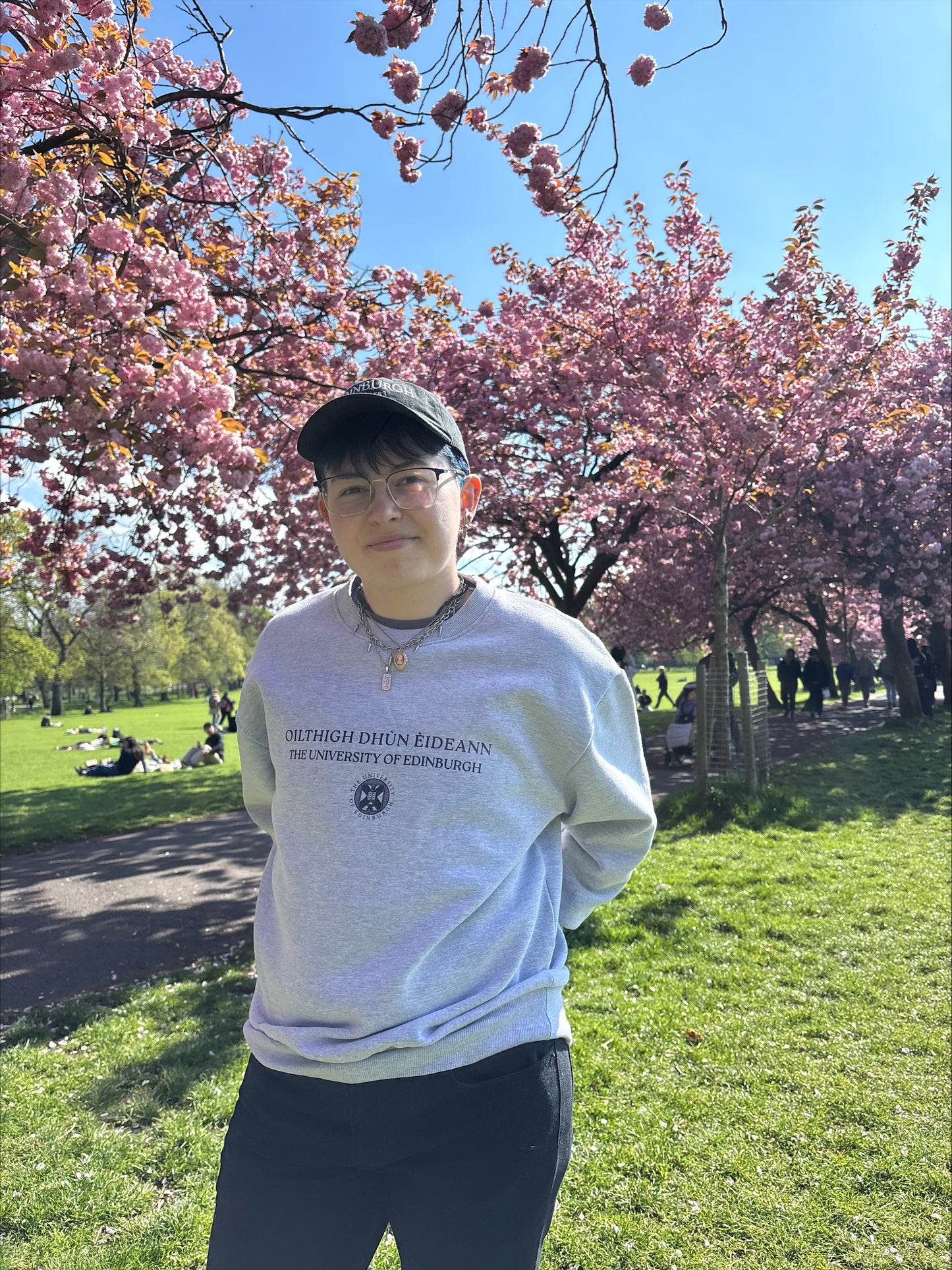 Model is pictured wearing our Premium Oversized Gaelic Bilingual Sweatshirt in the Meadows.