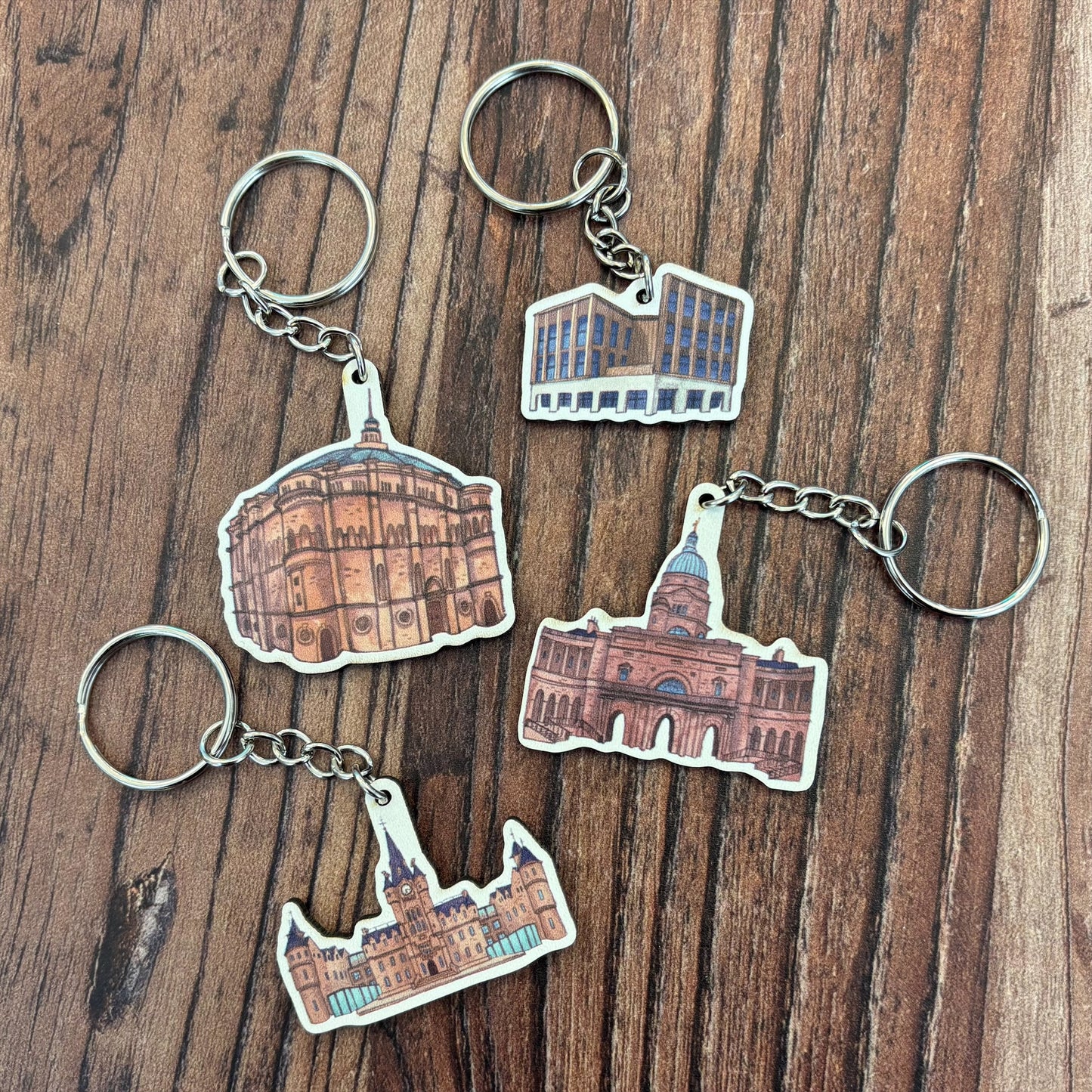 The Ally Mckay Buildings wooden keyring collection features McEwan Hall, The Nucleus, Edinburgh Futures Institute, and Old College.