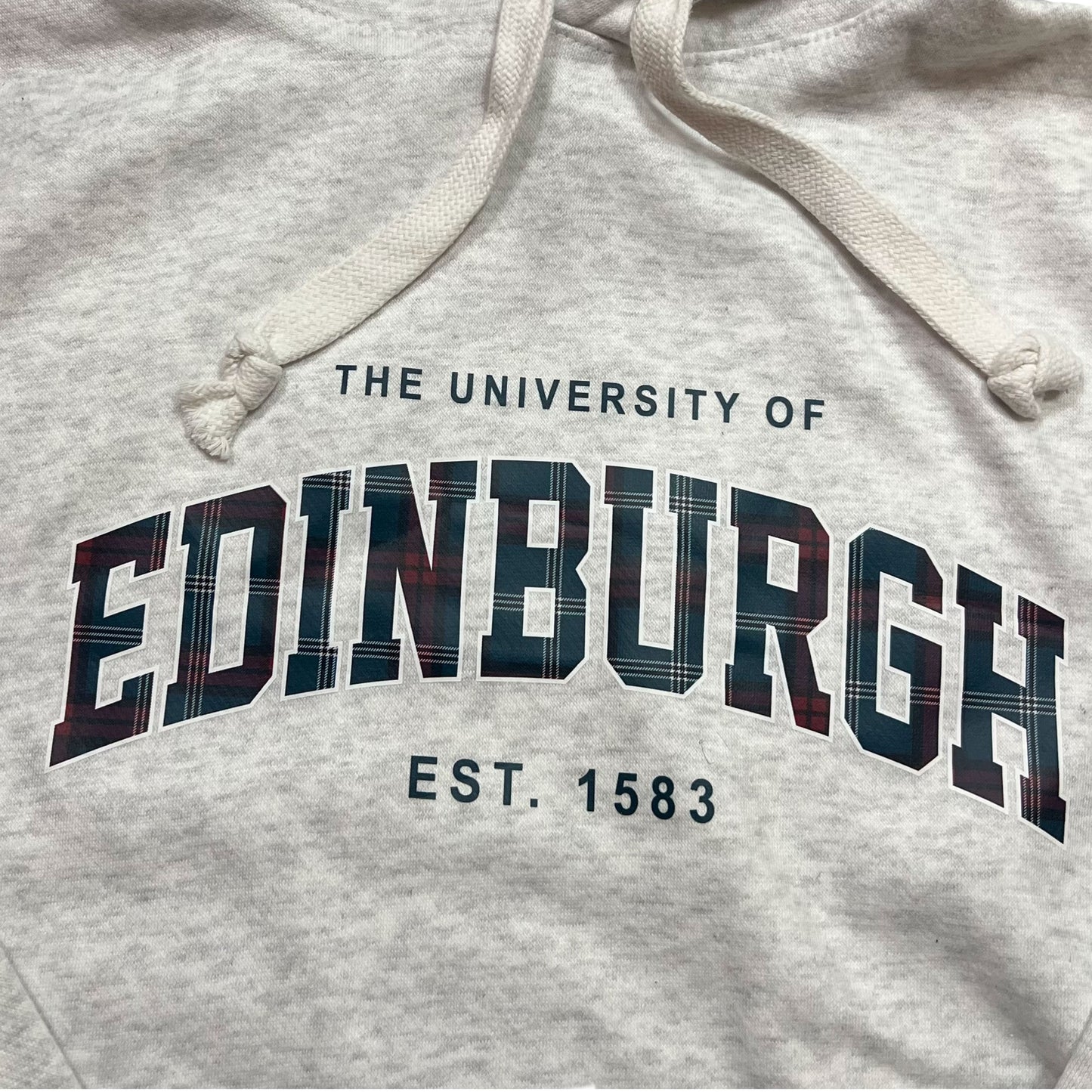 Close-up of 'The University of Edinburgh Est. 1583' in Tartan print on Ash Grey Hoodie.