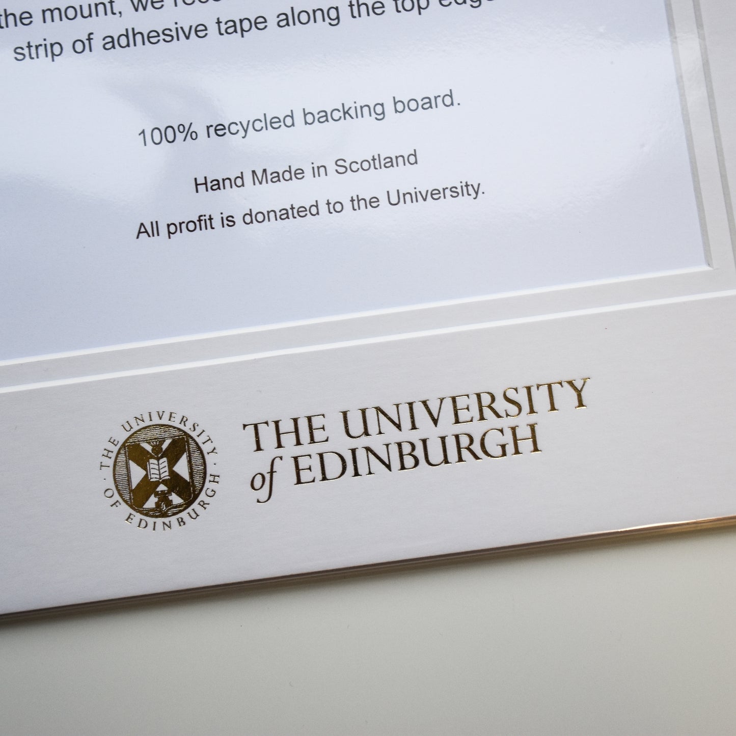 Close up of gold foil crest detailing.