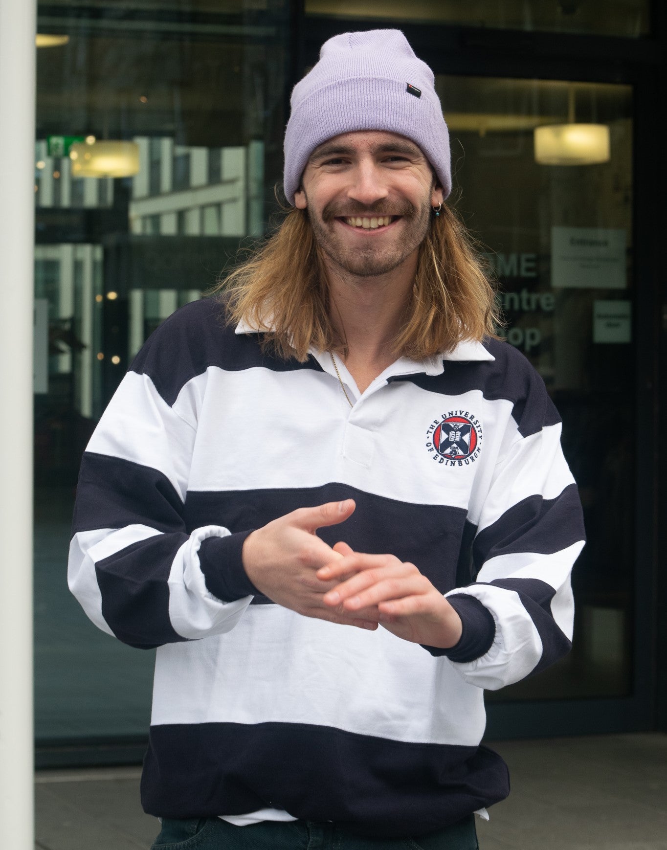 Model wearing Embroidered Crest Rugby Shirt in Navy/White