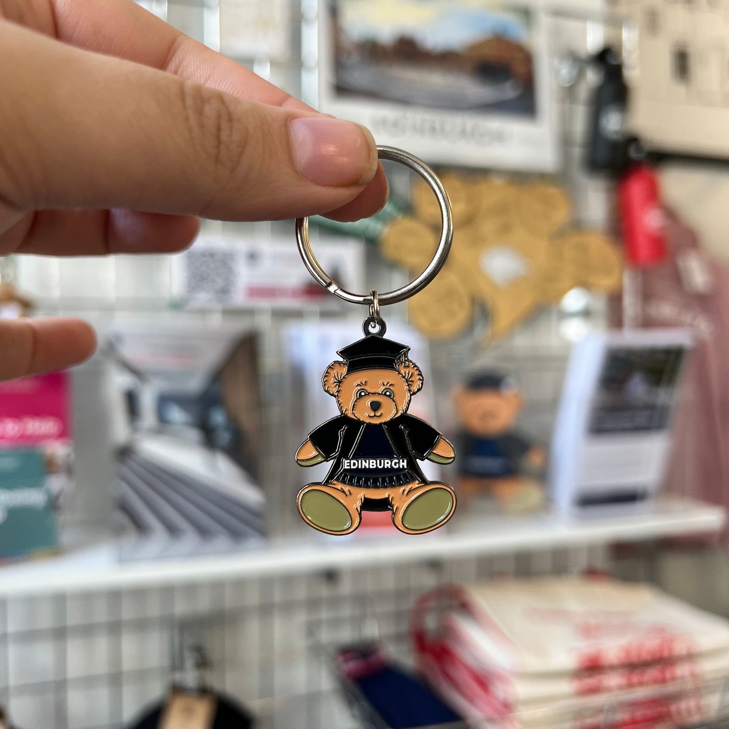 Enamel edinbear keyring wearing graduation robe and hat