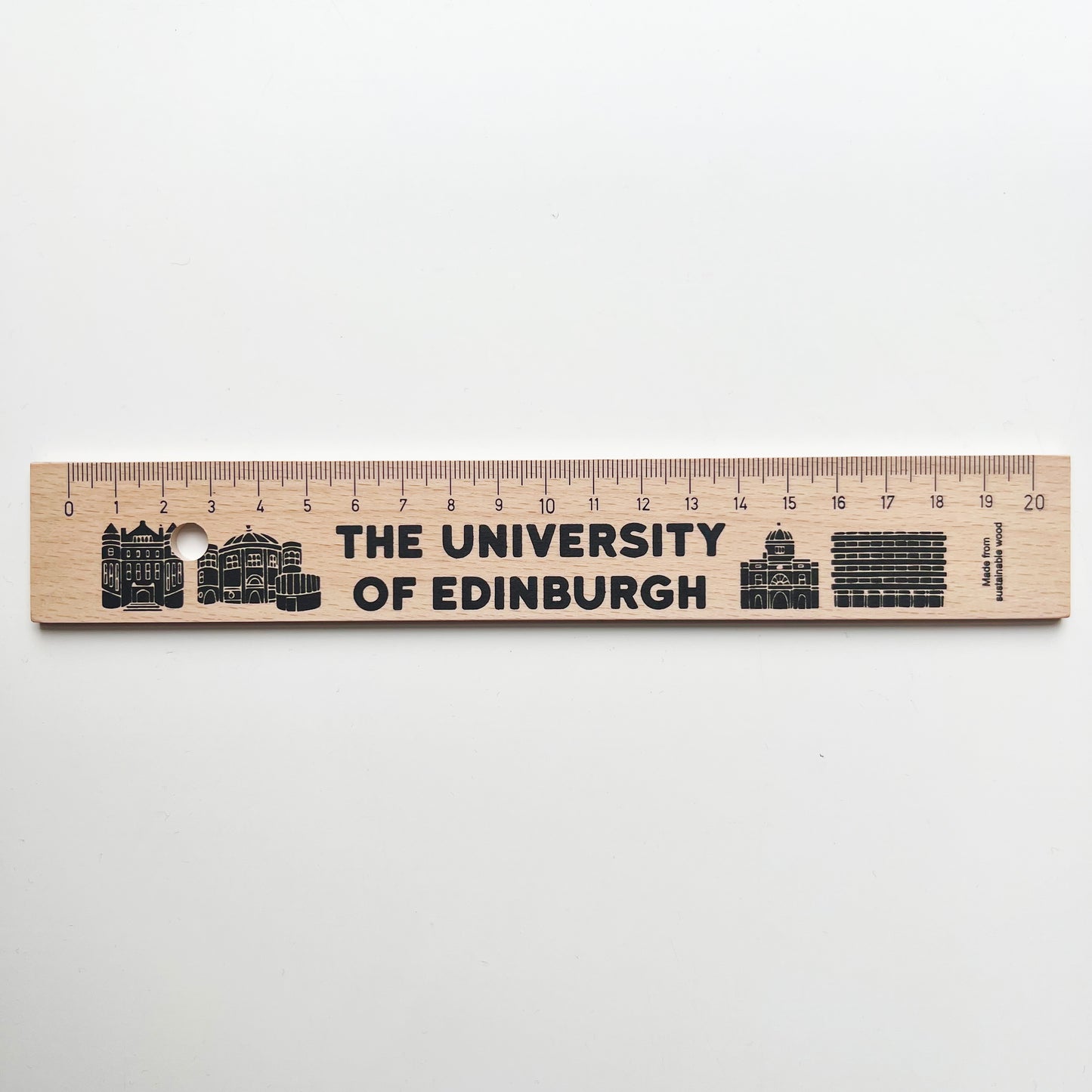 Wooden ruler with iconic university buildings printed on