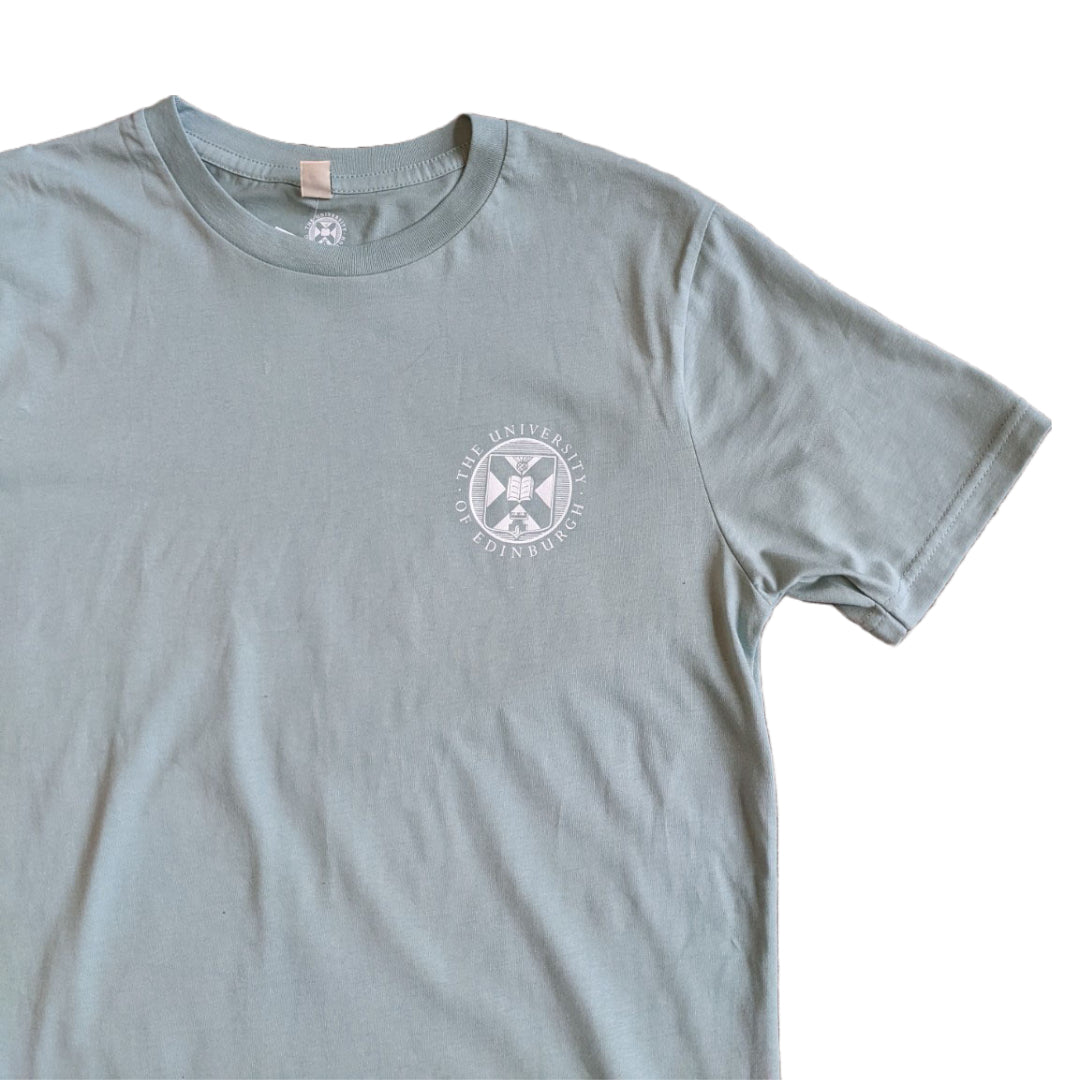 A light blue green t-shirt with the University crest printed in white