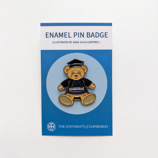 Full body plush bear pin with graduation gown and cap. 