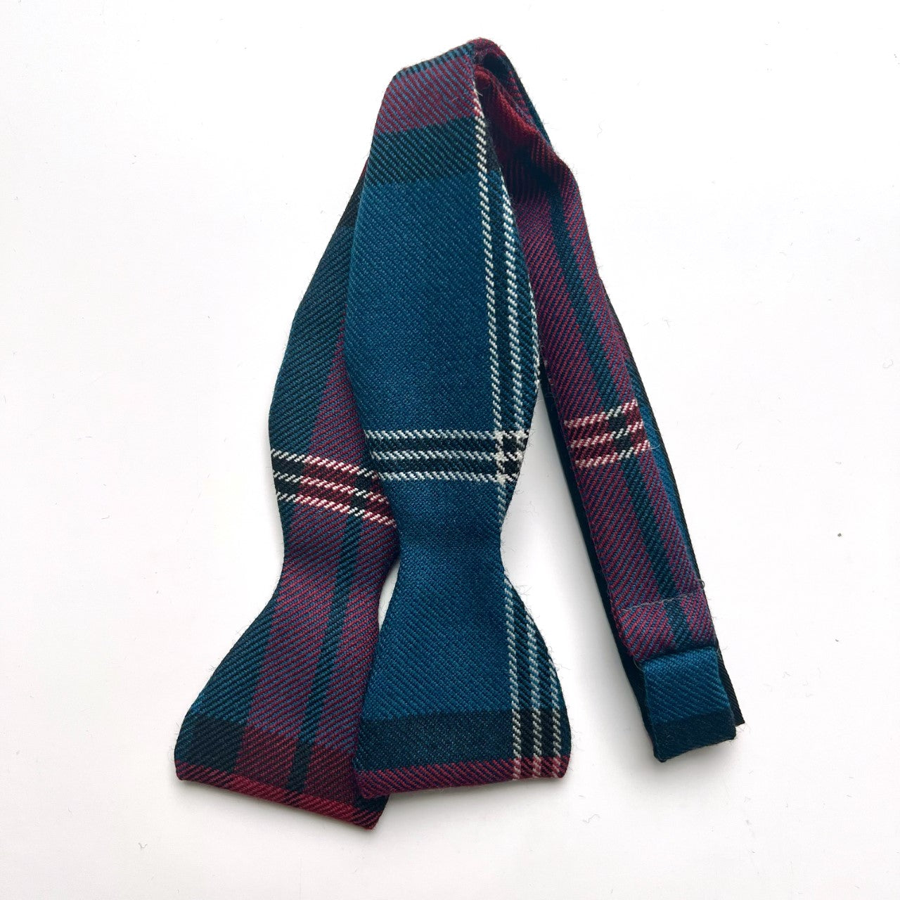 Self tying bow tie in the University tartan.