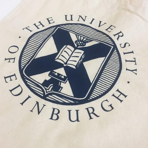 Close up of navy blue University crest on cotton shopper bag