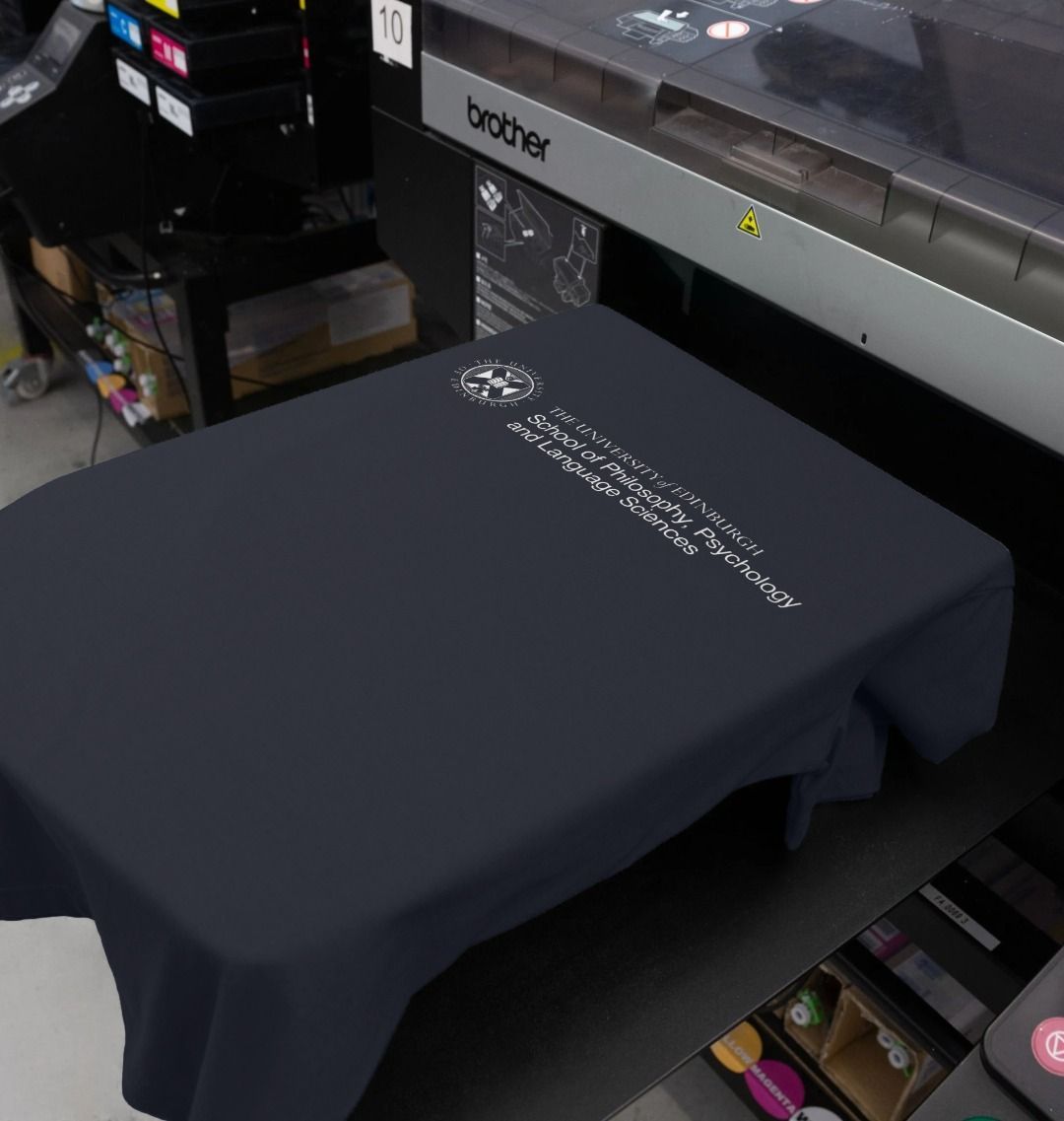 Our School of Philosophy, Psychology and Language Sciences T Shirt being printed by our print on demand partner, teemill.