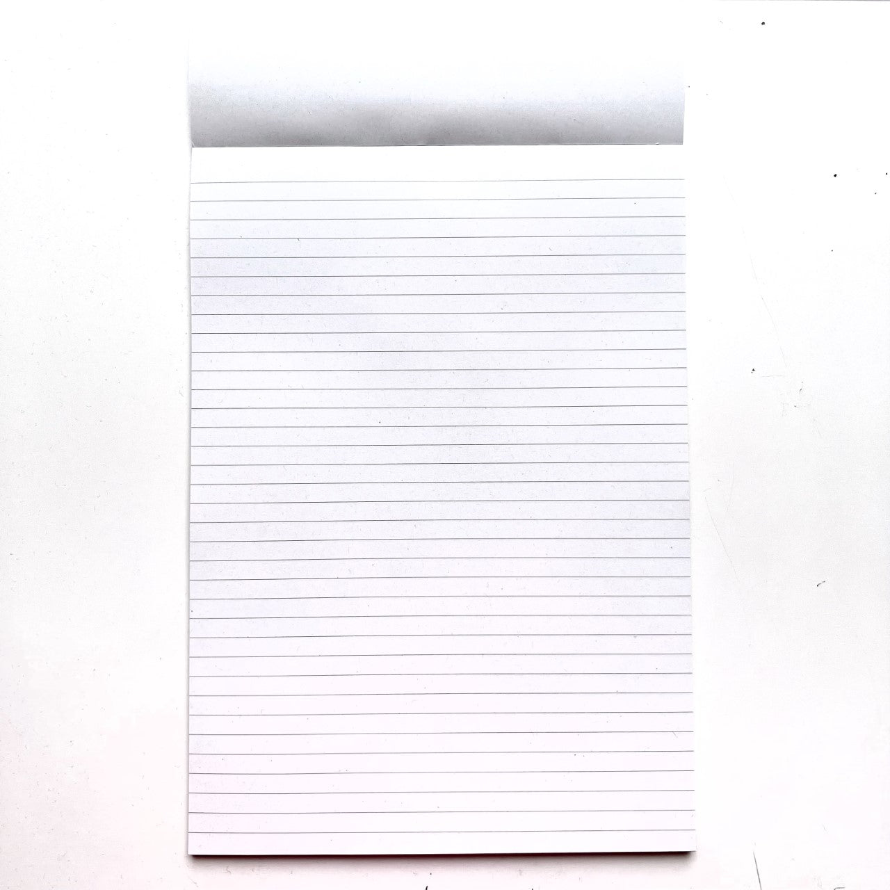 Ruled line paper from the inside of our A4 Recycled Notepad