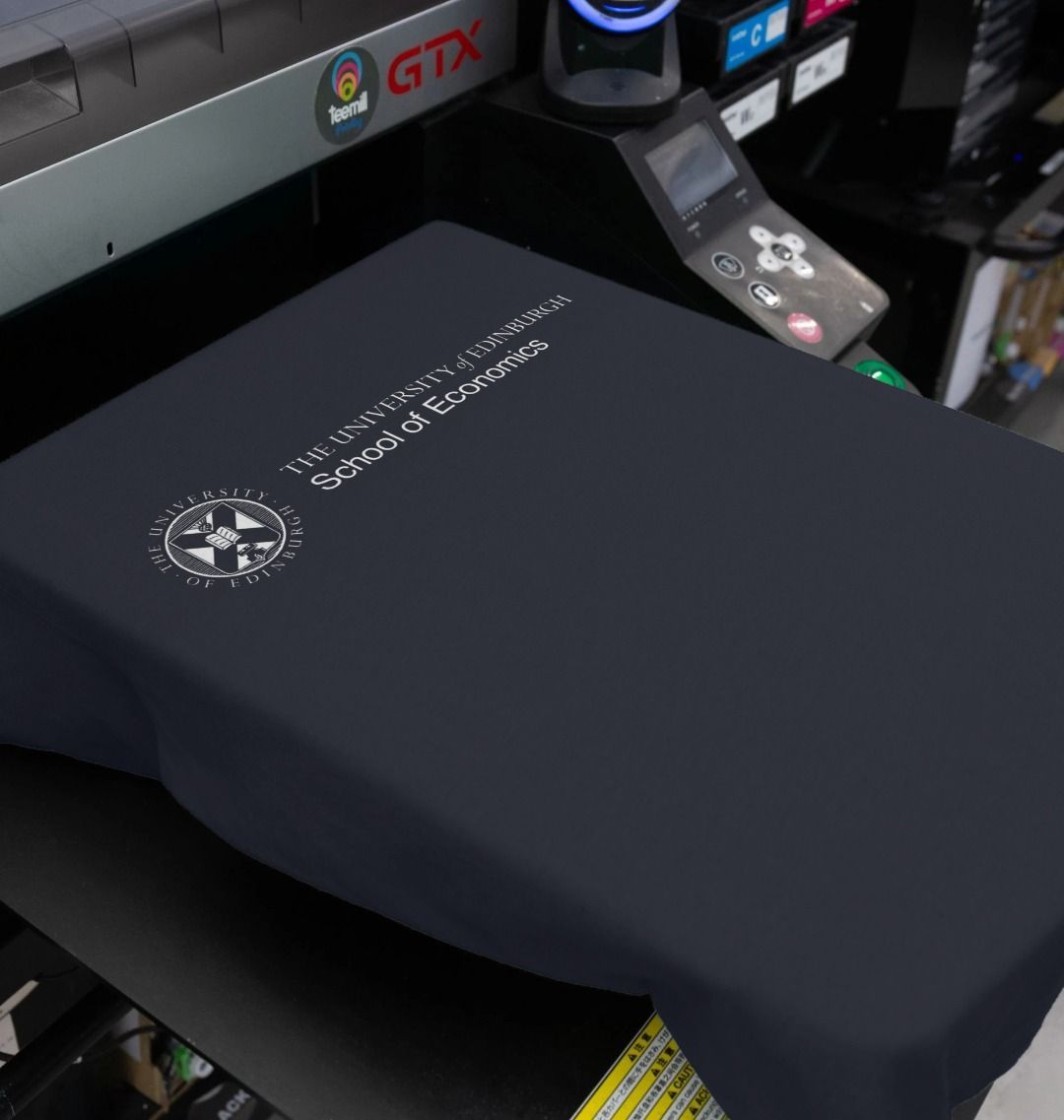 Our School of Economics T Shirt being printed by our print on demand partner, teemill.