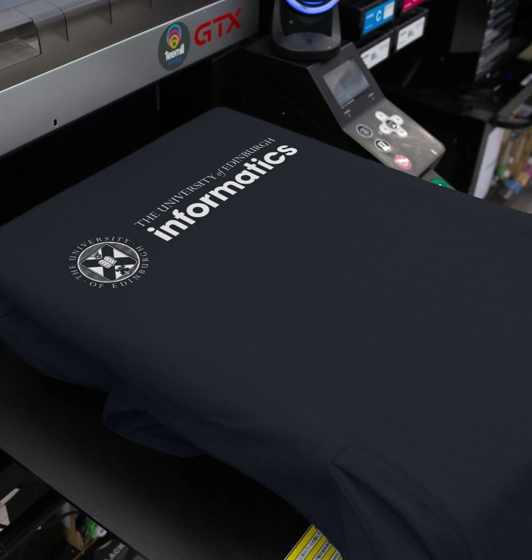 Our School of Informatics Hoodie being printed by our print on demand partner, teemill.