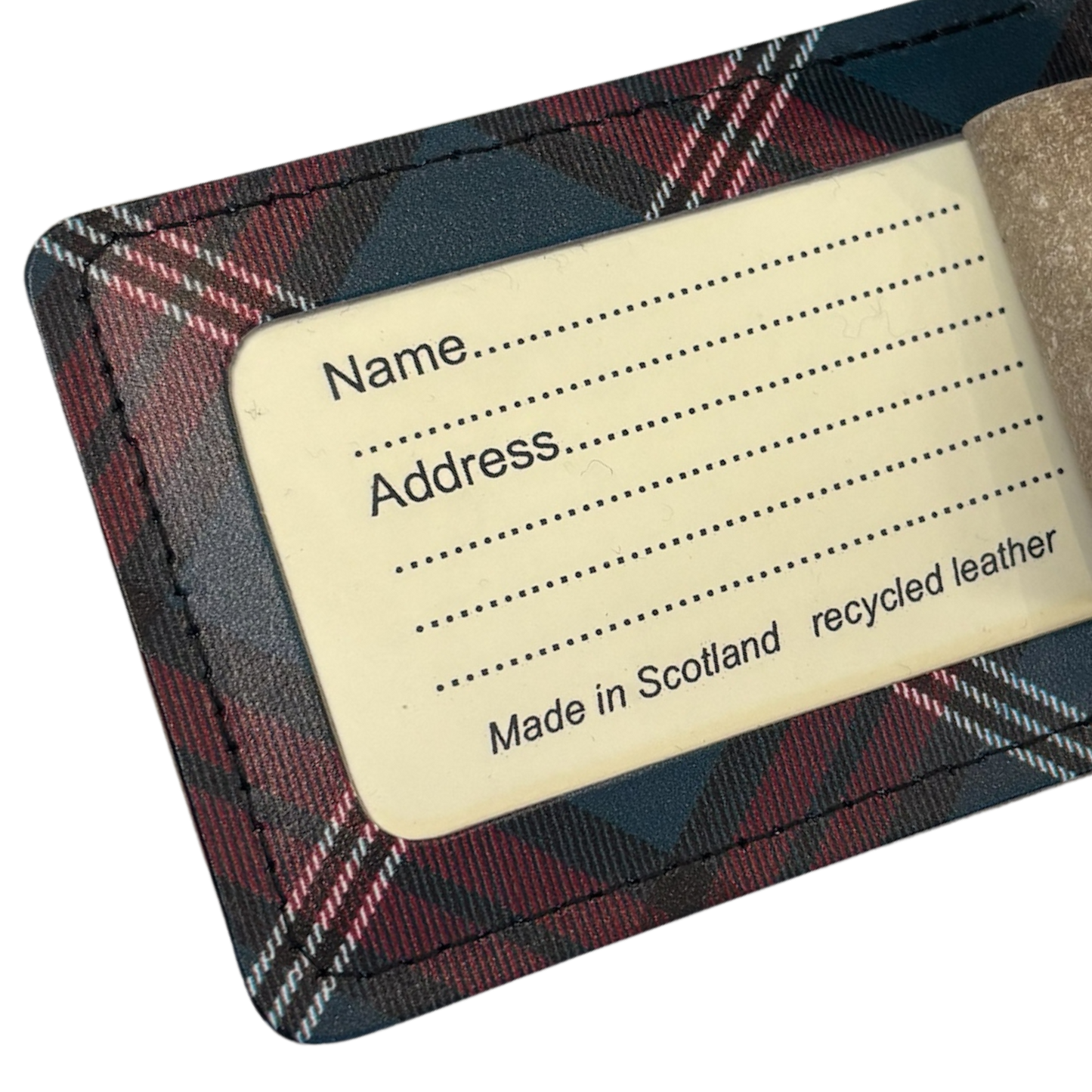 Luggage tag information card with name and address label.