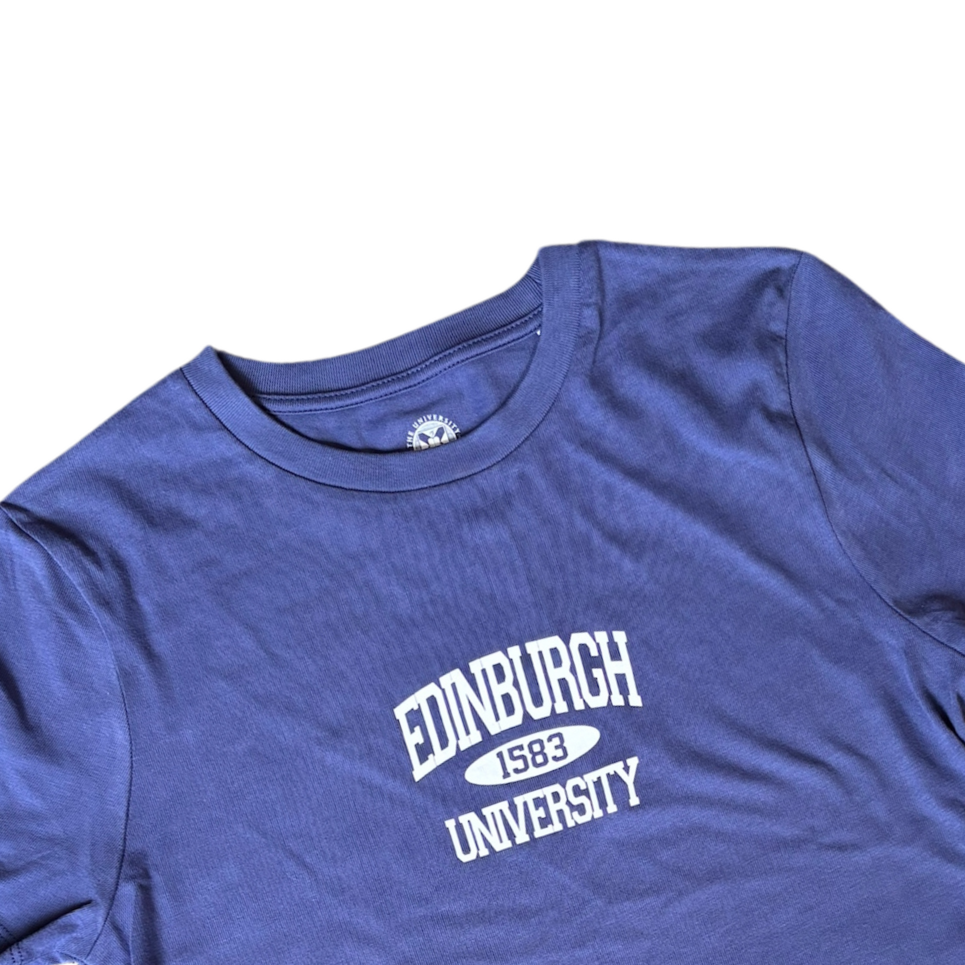 Short-sleeve T-shirt in a purple-blue colour, with white text reading “Edinburgh University 1583” printed on over the chest.
