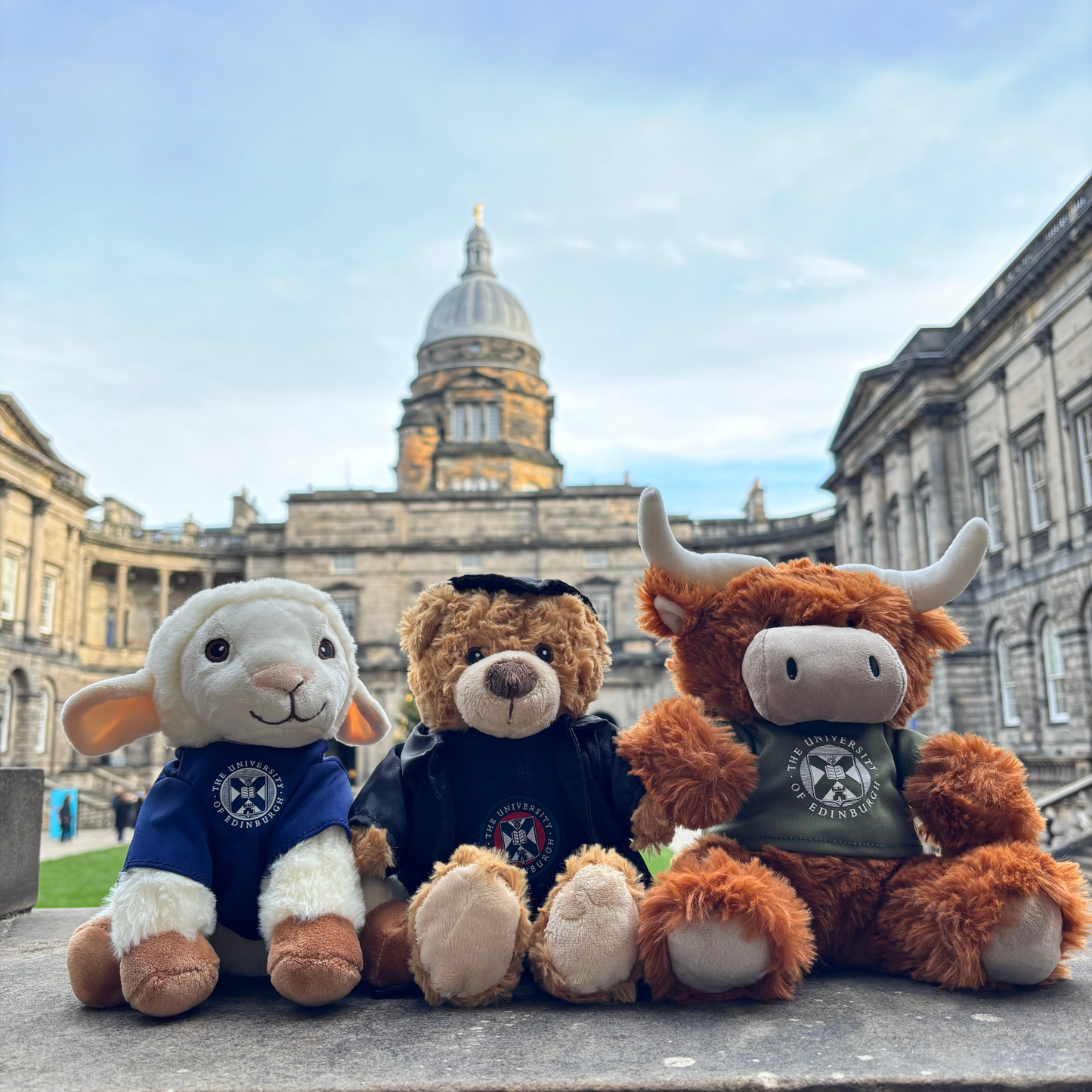 Dolly the Sheep plush, Edinbear plush, and McCoowan plush in the Old College Quad.