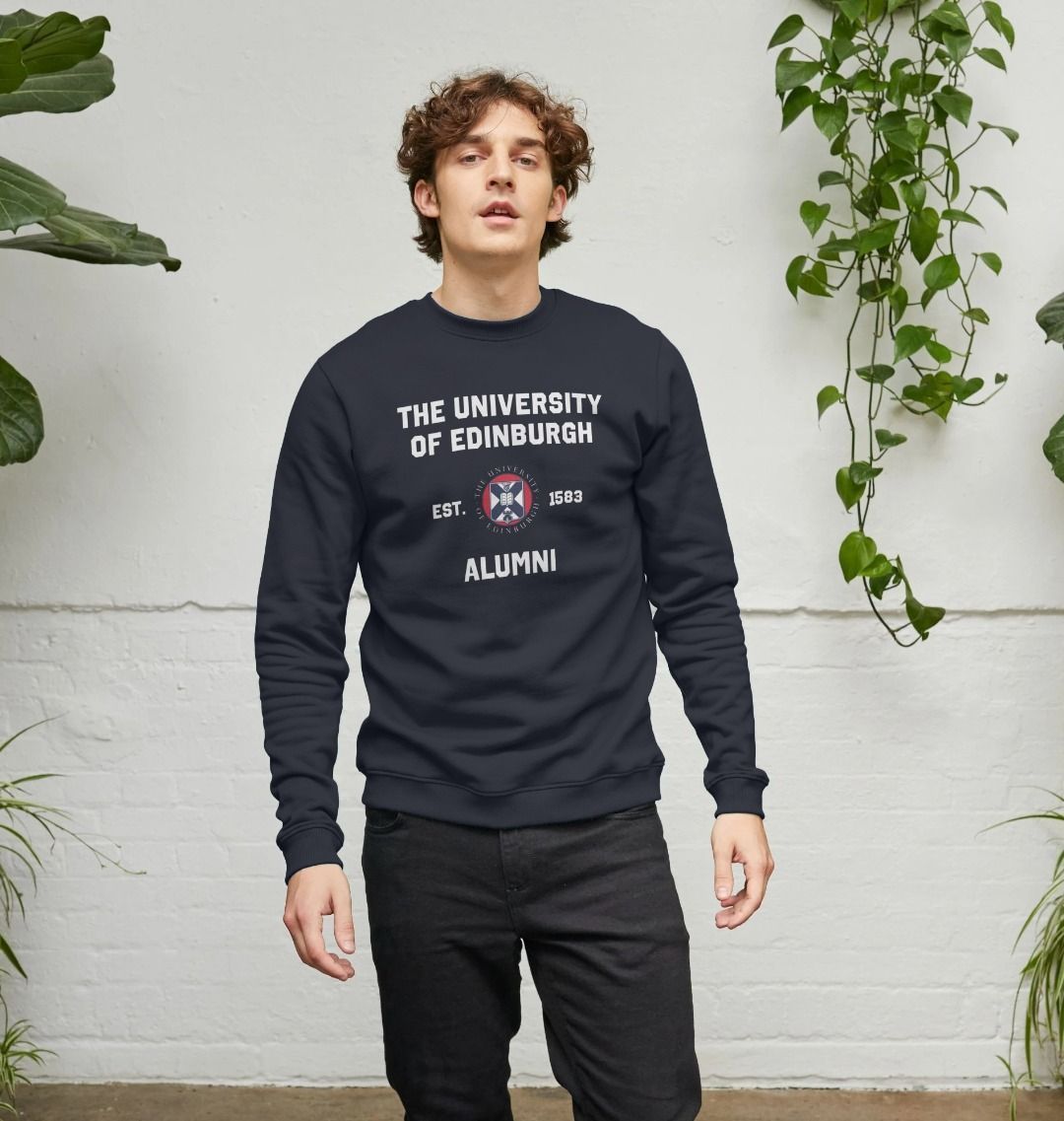 Model wears Black Varsity Alumni Sweatshirt