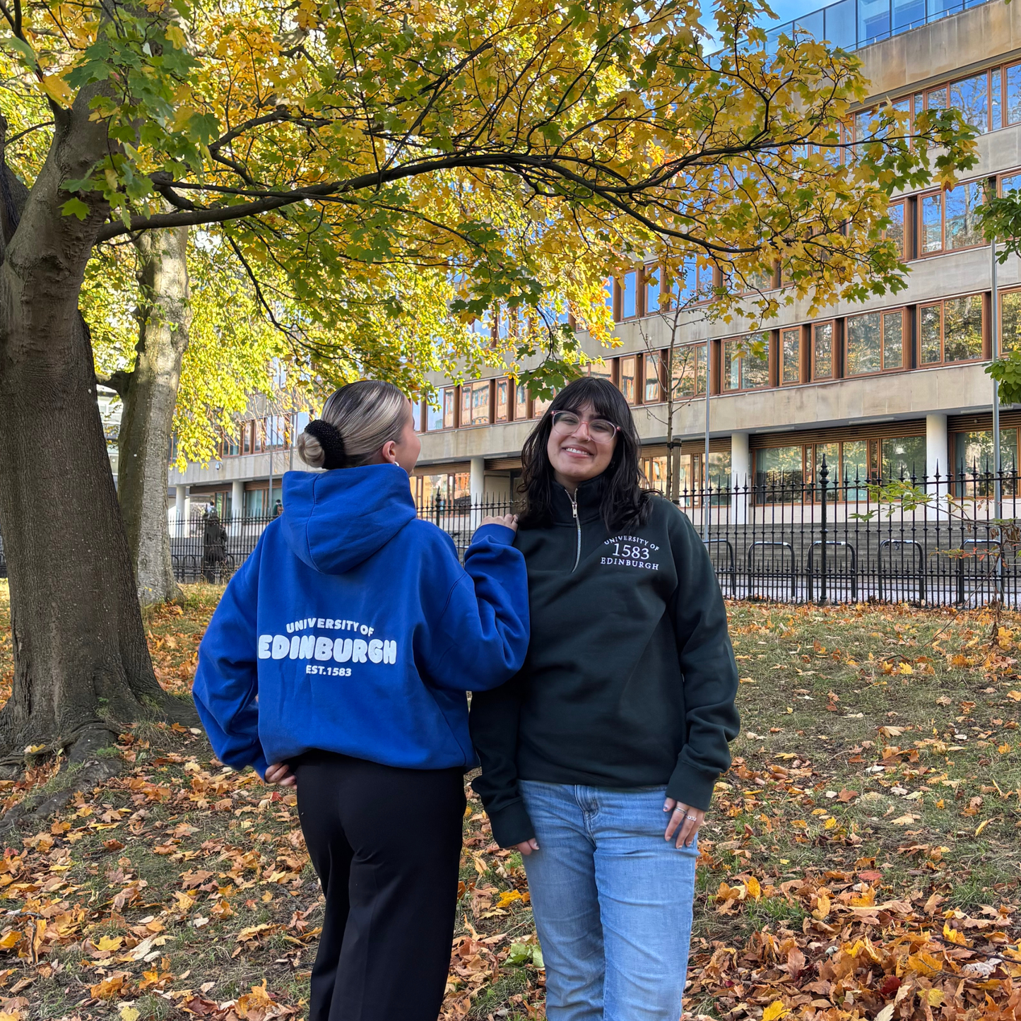 Model on right wears the 1593 Quarter Zip in pine green.