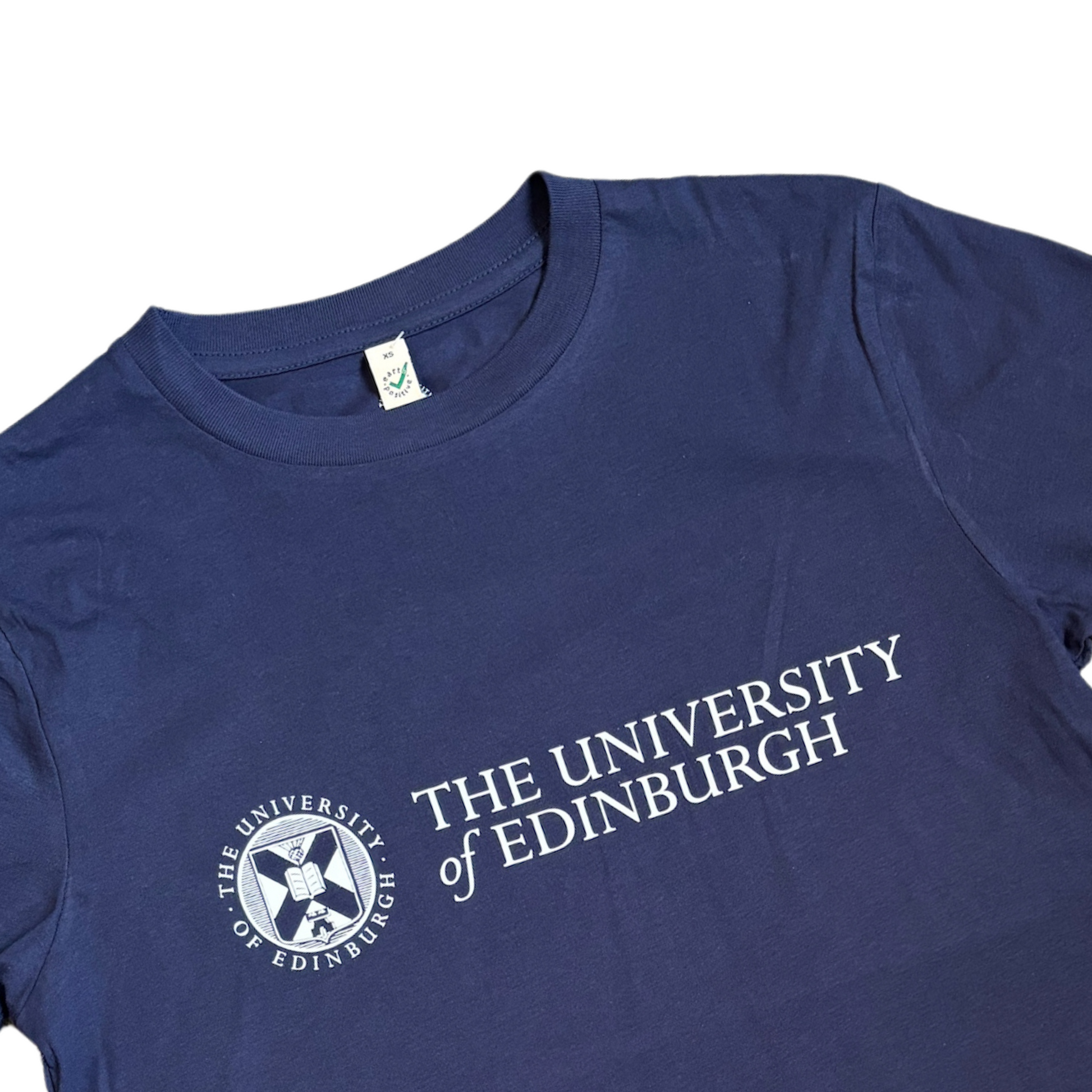 Close up of French navy blue t-shirt with the University logo printed across the chest in white 