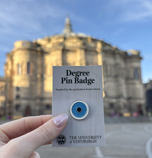 Education: Round pin with white outer circle, light blue middle circle and black inner circle
