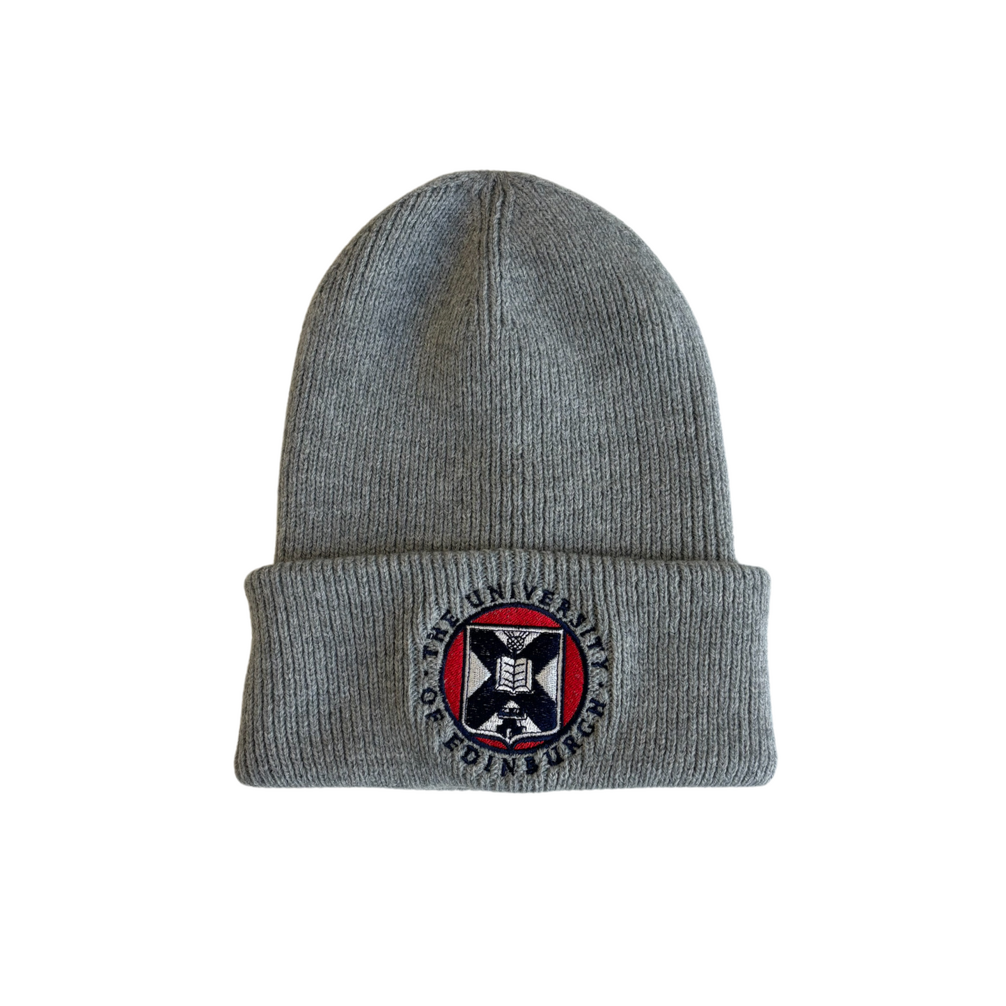 grey ribbed cotton beanie with red, white, and navy embroidered university crest