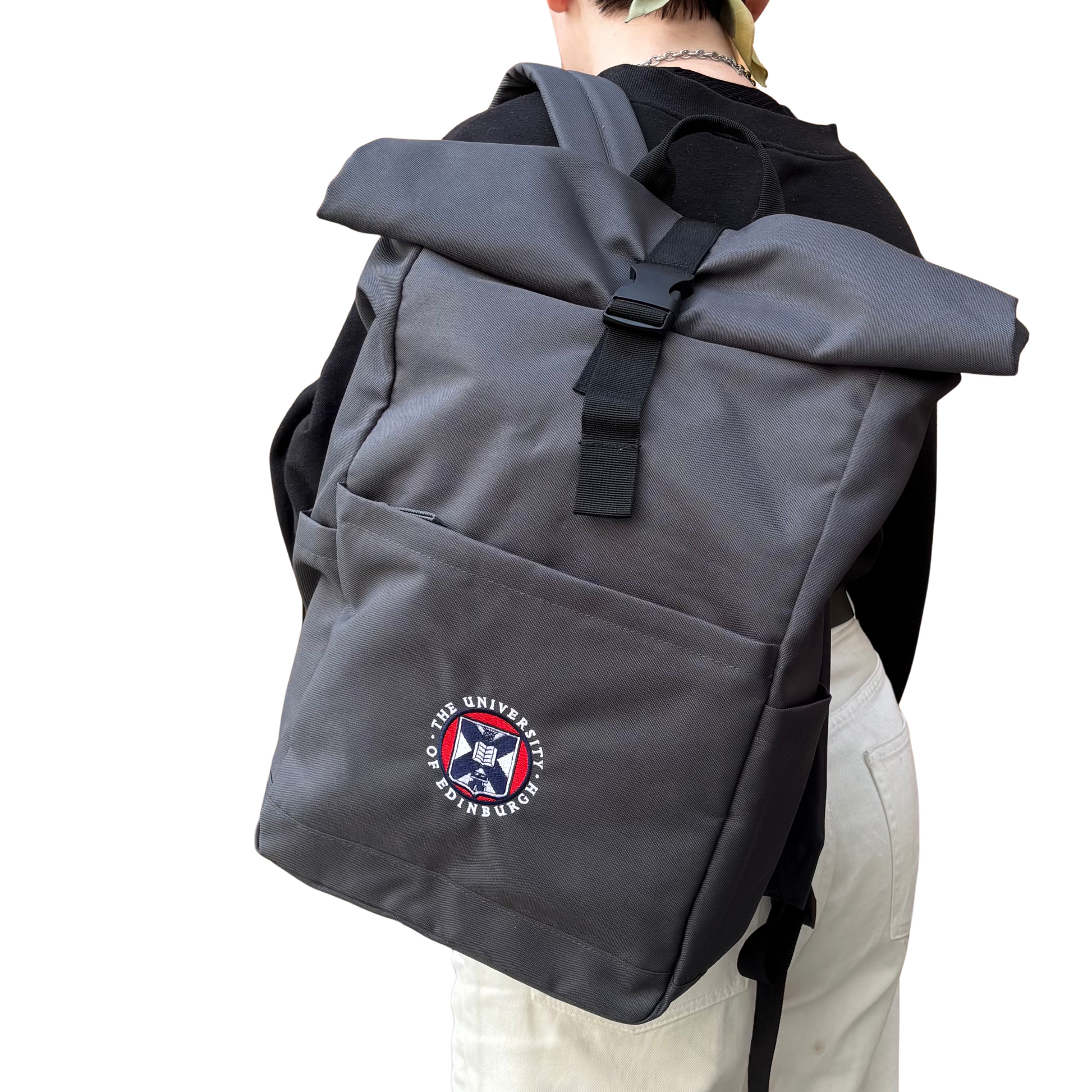 The Classic roll top backpack in graphite features a full colour embroidered University Crest.