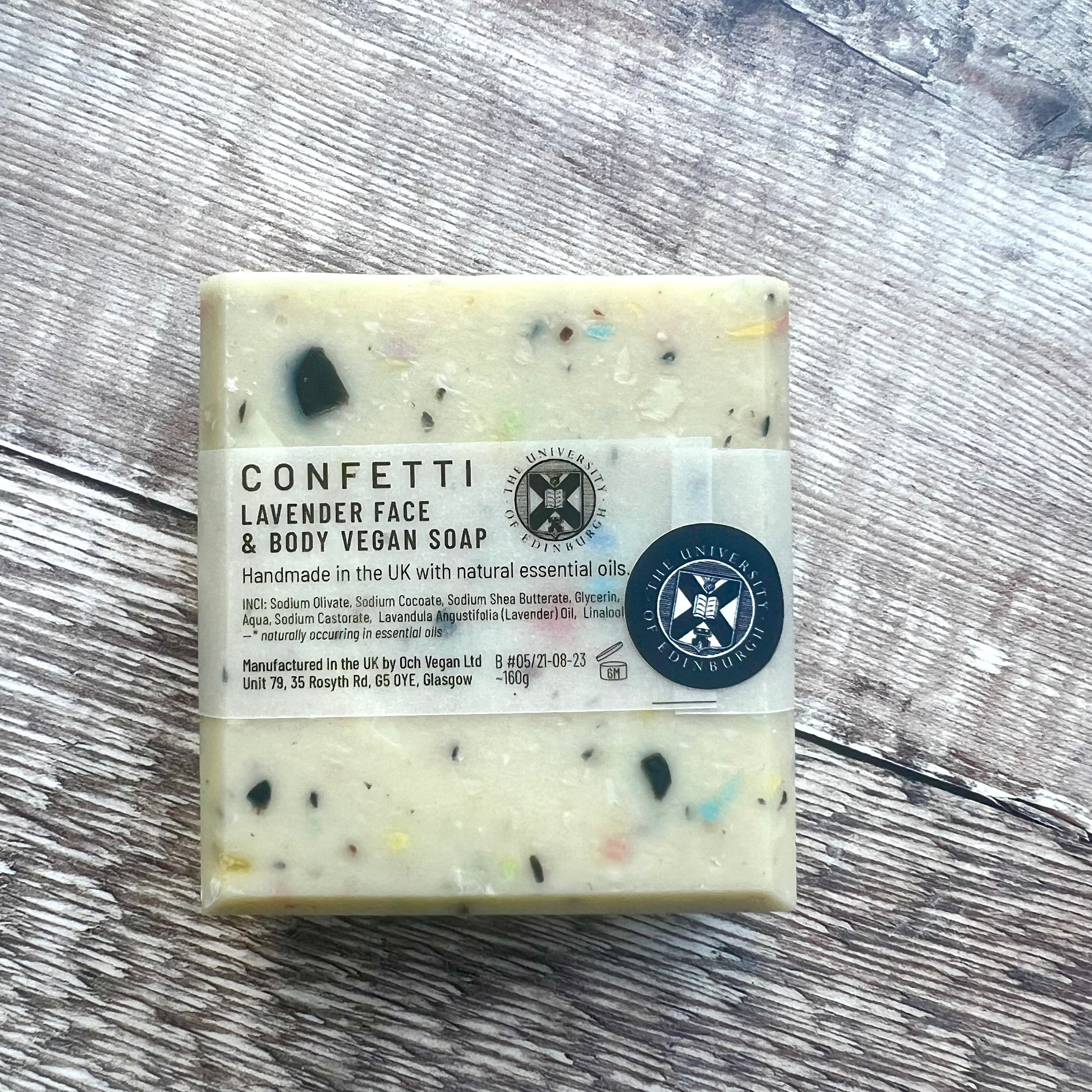 back on confetti soap with label featuring the university crest