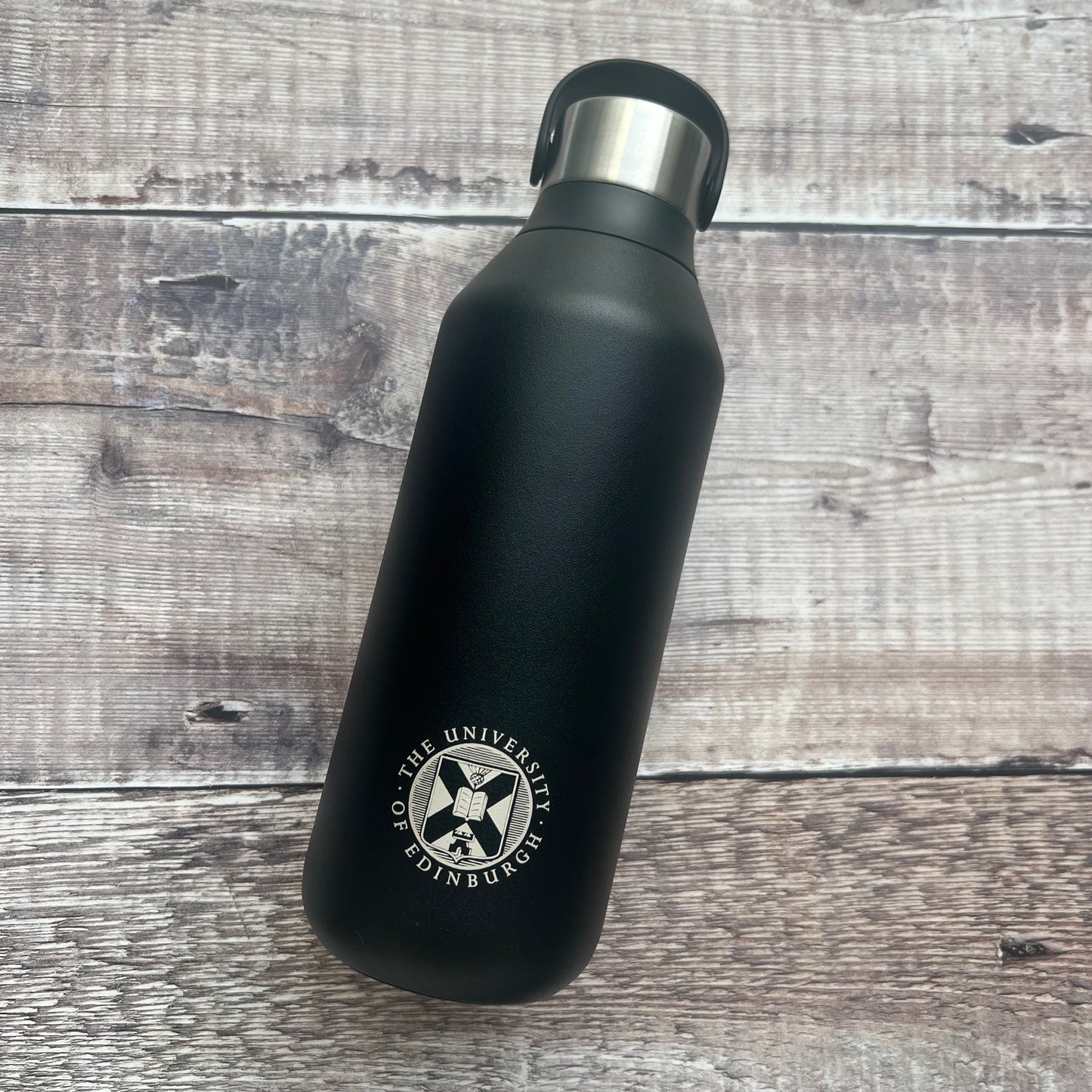 Black chillys bottle with the university crest engraved