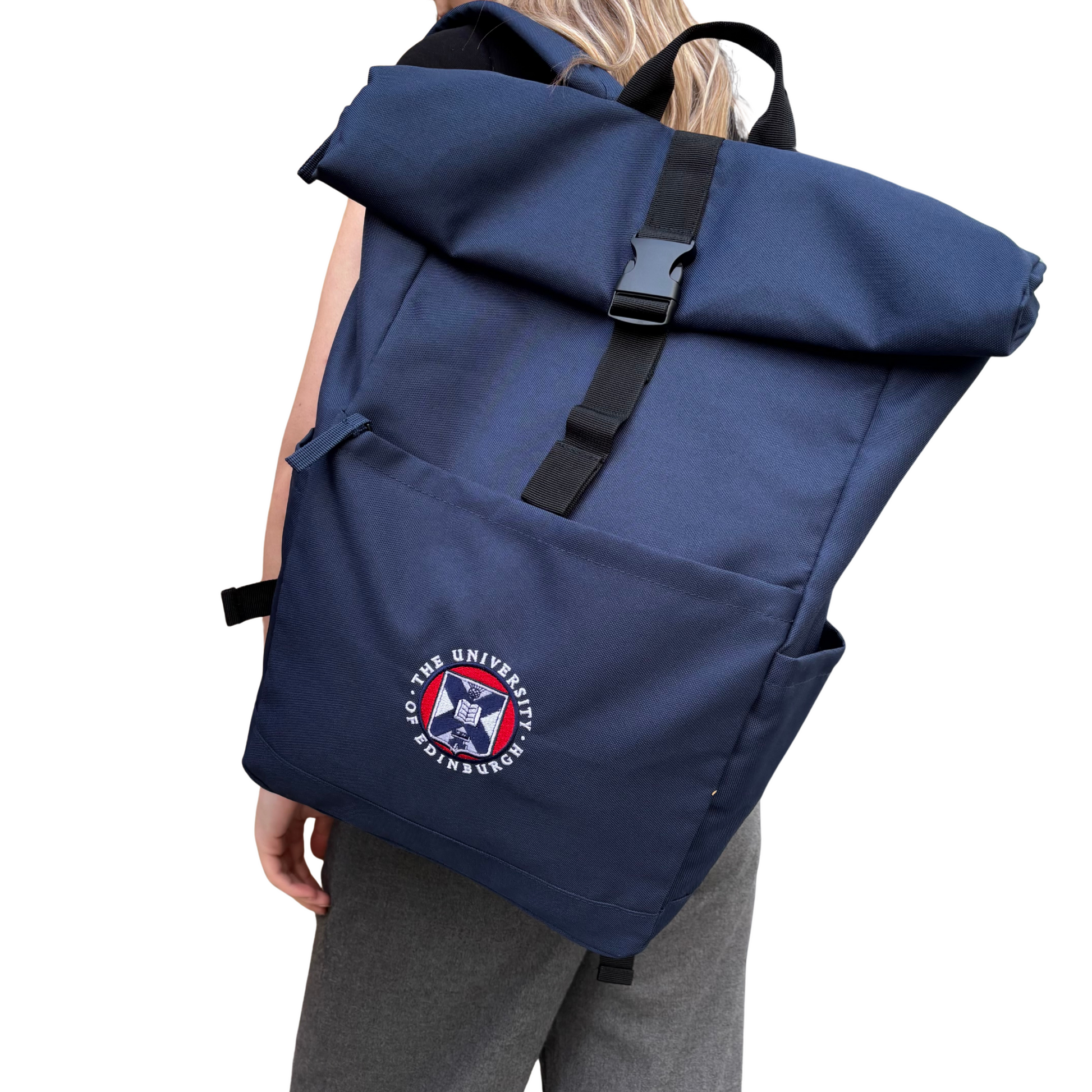 The Classic roll top backpack in navy features a full colour embroidered University Crest.