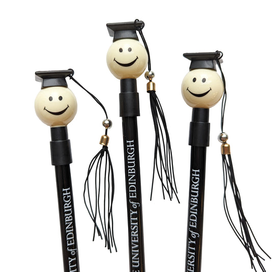 novelty pen featuring a smiling face and a black graduation cap with a tassel