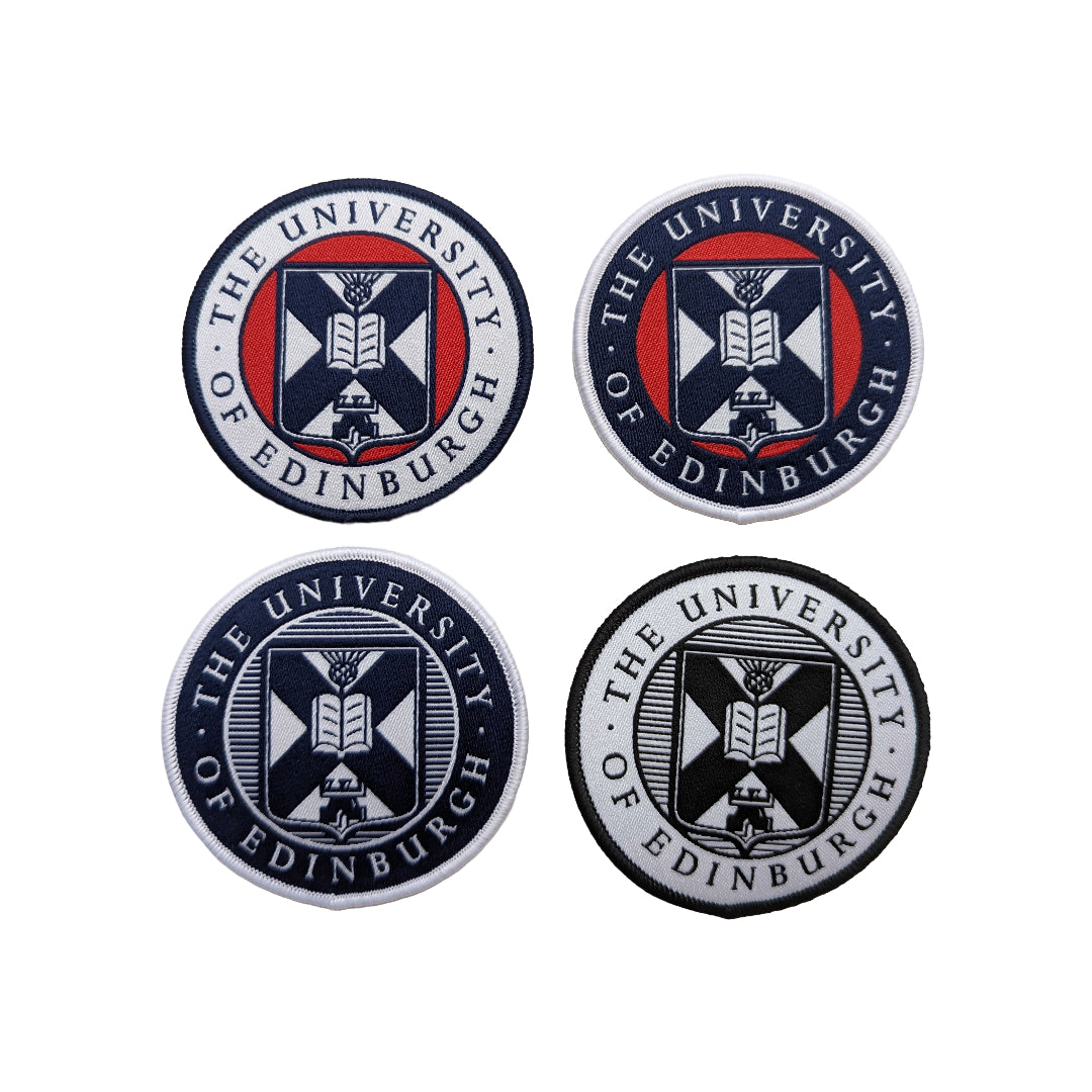 From top left corner across: white university of edinburgh crest woven patch with red and navy; navy university crest patch with red and white; navy and white university crest patch; black and white university crest patch on a white background