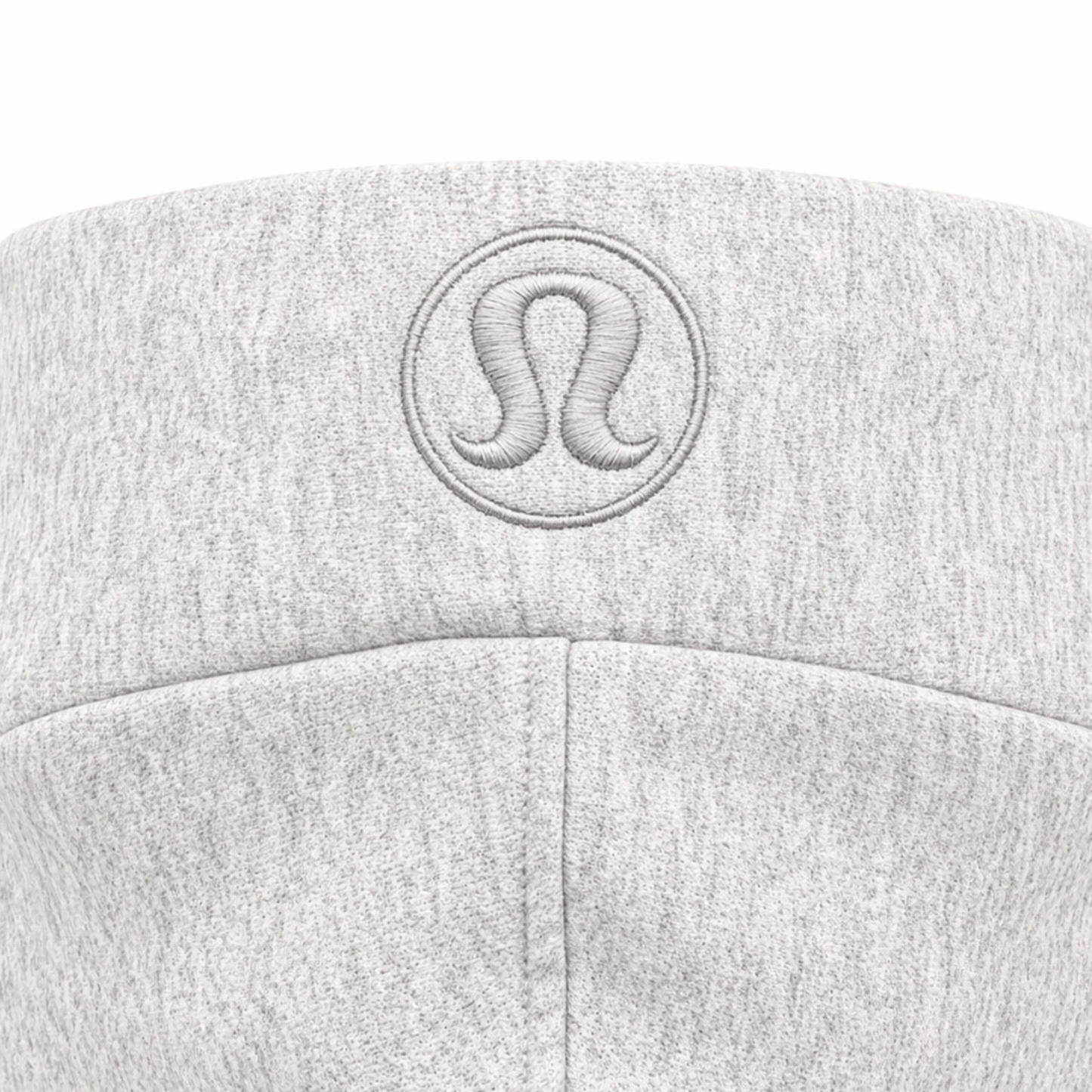Close up of embroidered lululemon logo on hoodie