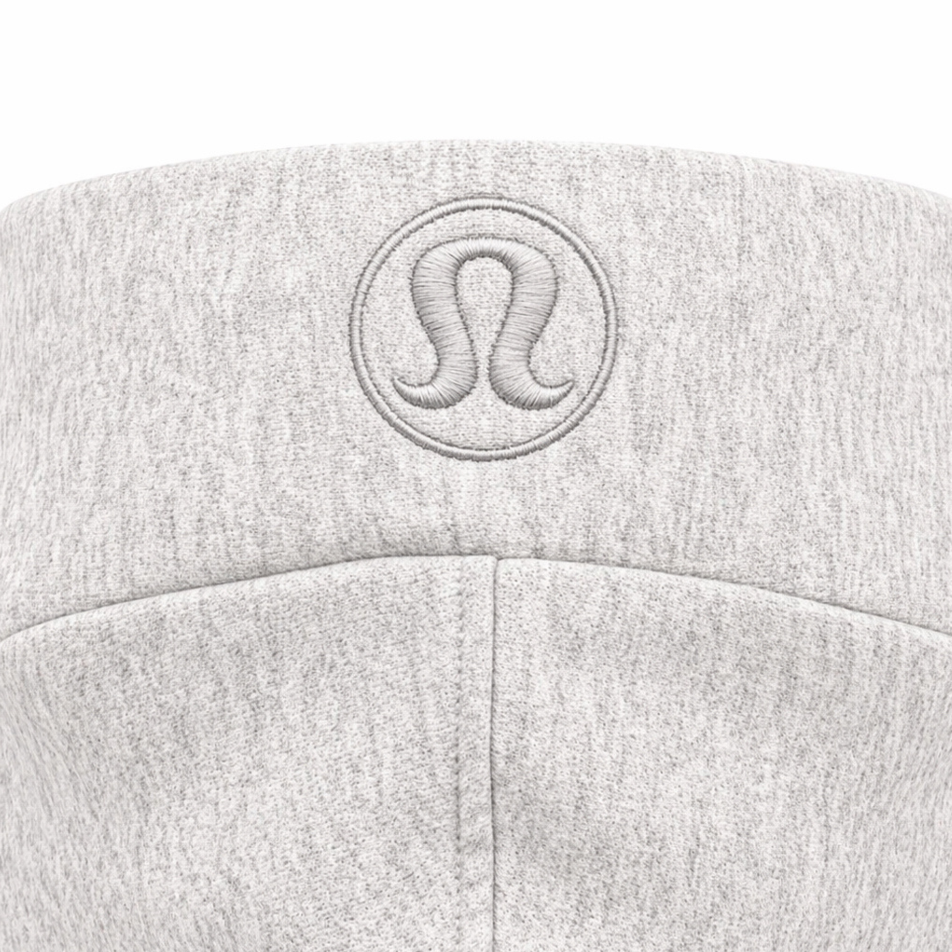 Close up of embroidered lululemon logo on hoodie