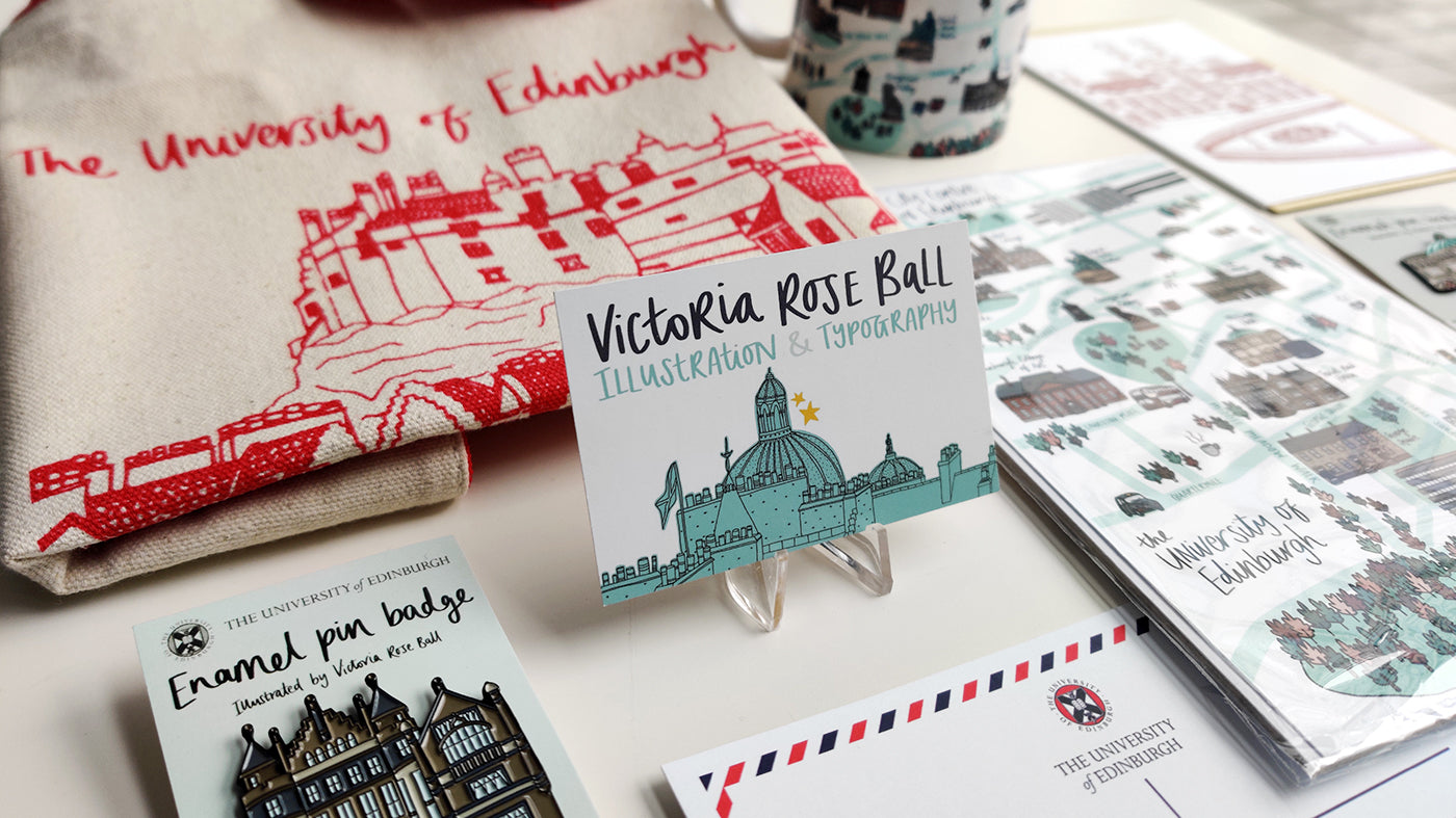 Victoria Rose Ball's business card next to items illustrated by Victoria 