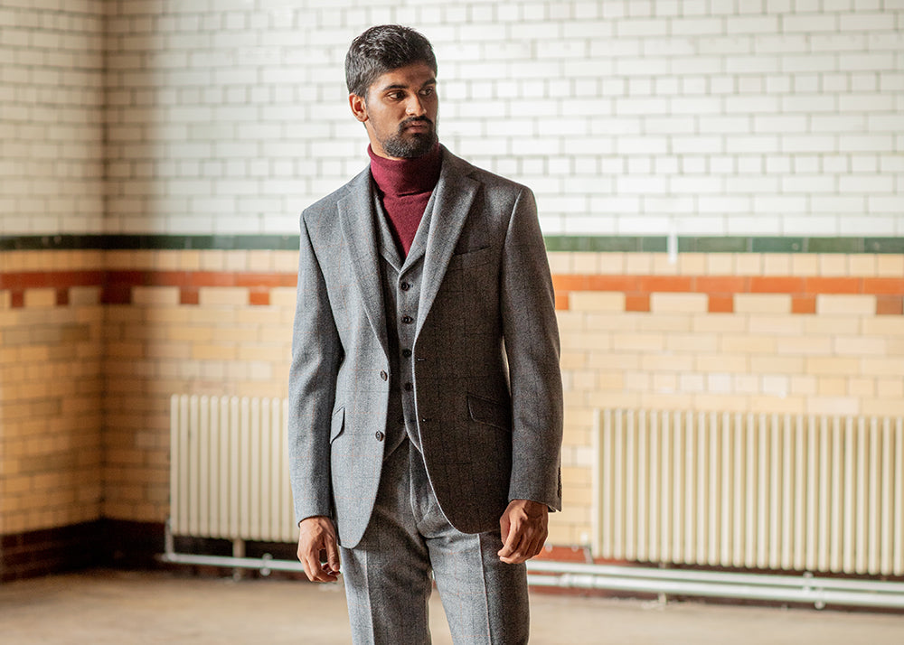 A model wearing the University tweed jacket, waistcoat and trousers