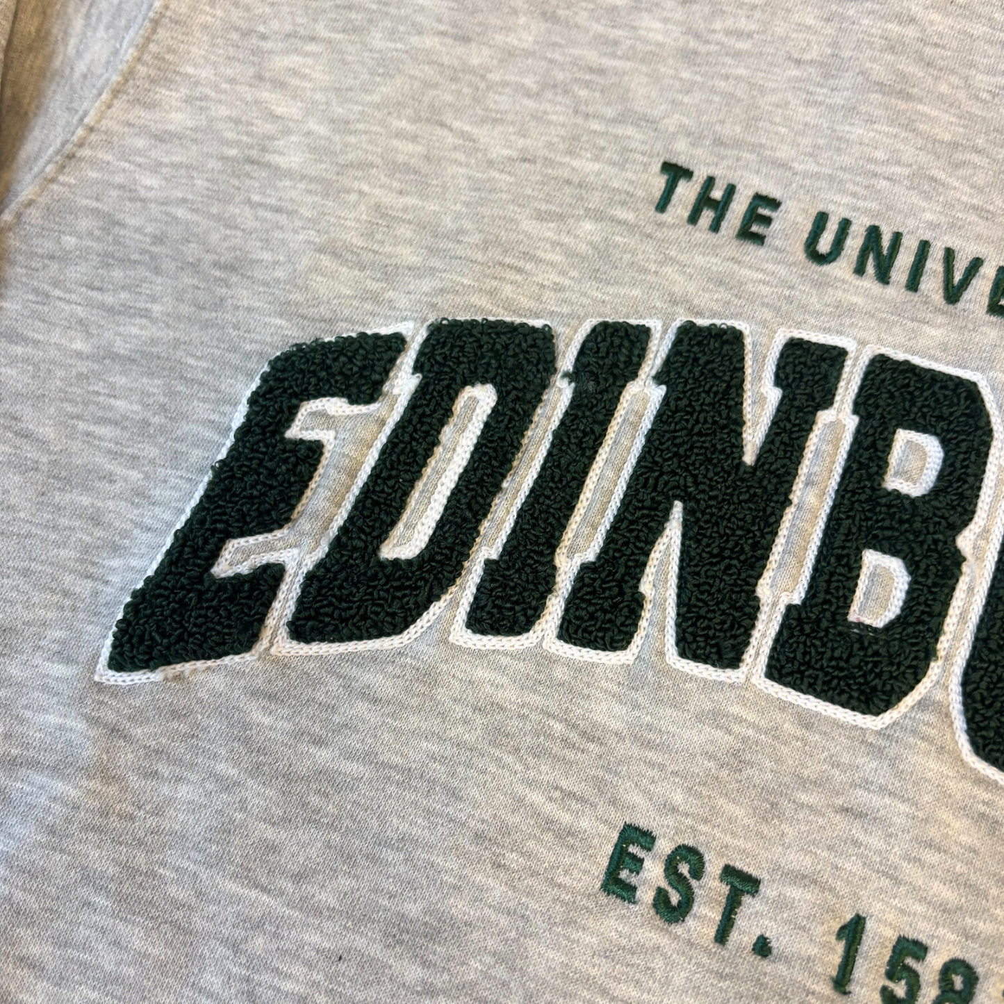 close up of the green chenille applique letters.