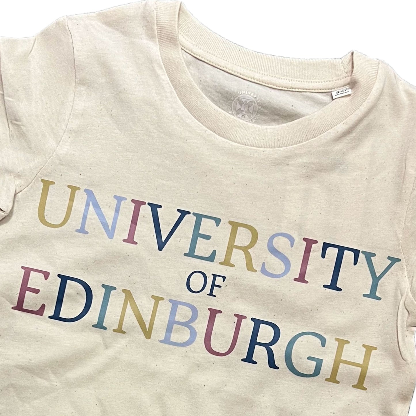 Close-up of text on Colourful Kids T-shirt.