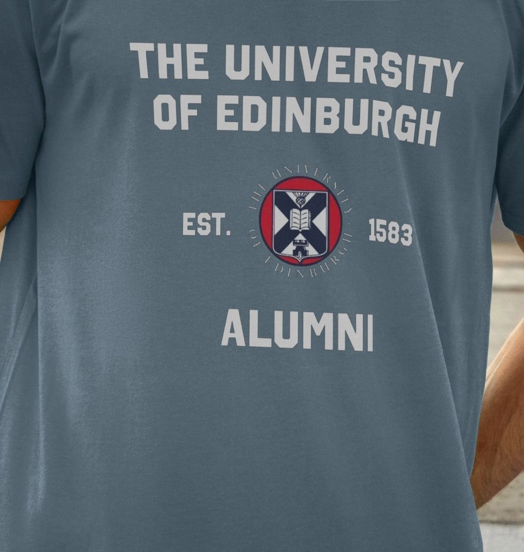 Close-up of model wearing Stone Blue Varsity Alumni T-Shirt.