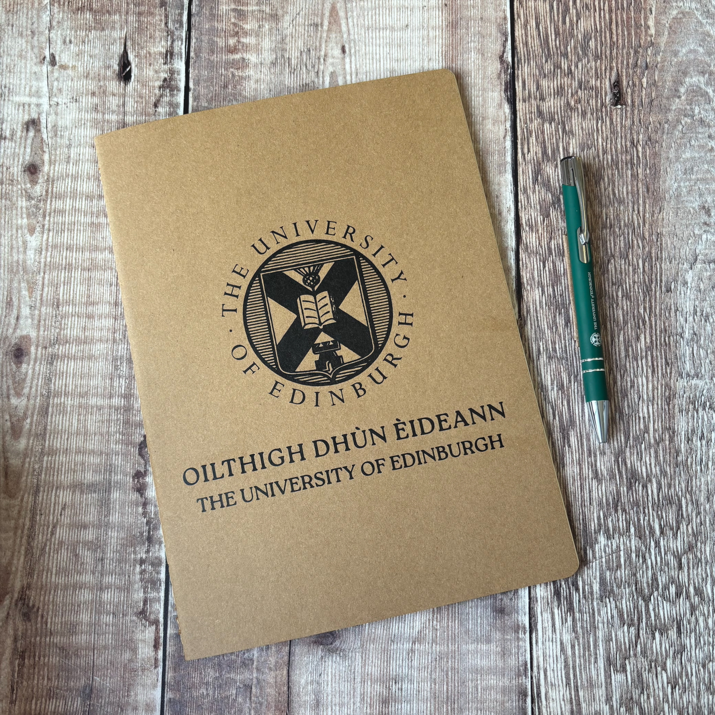 Recycled notebook pictured with our green premium soft feel pen.