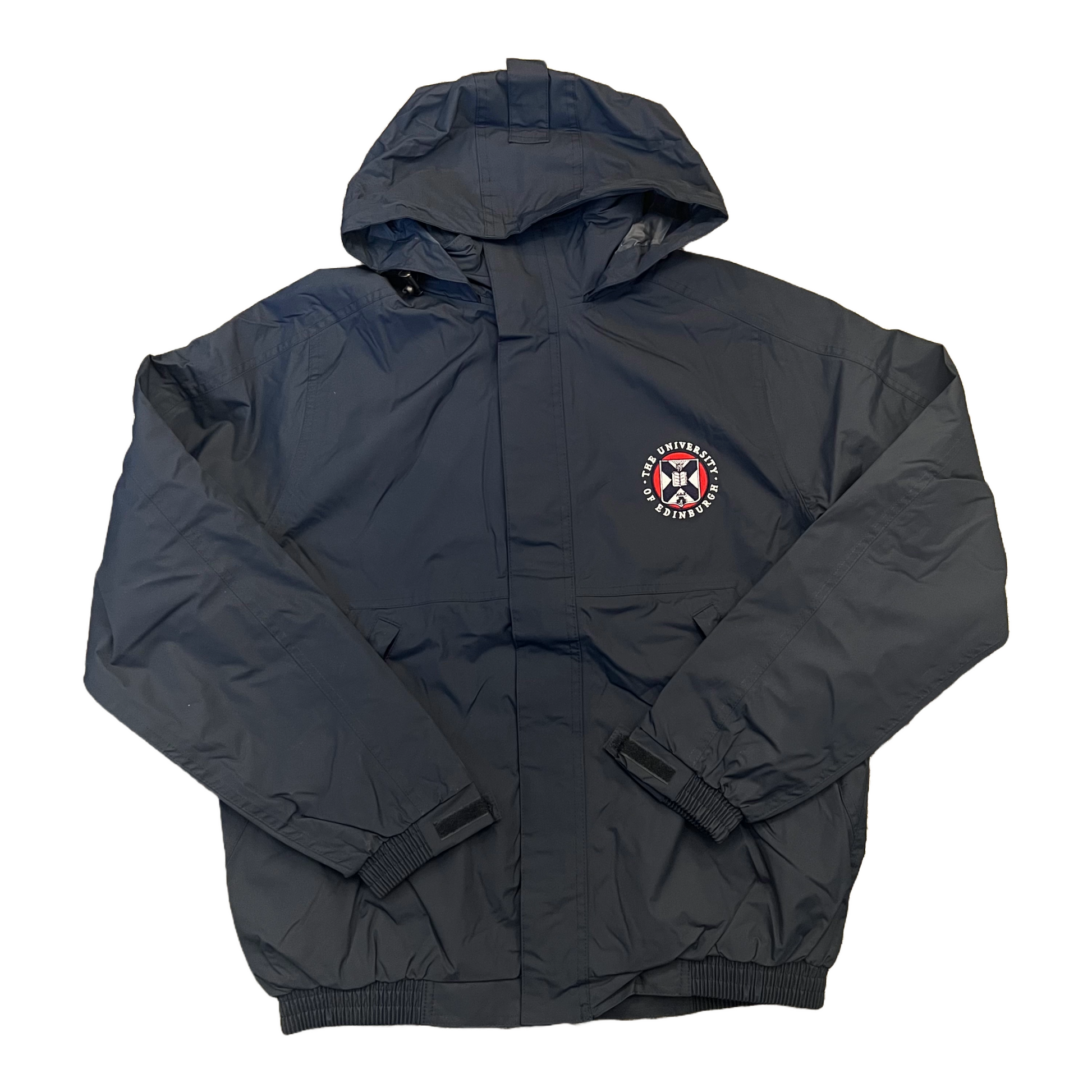 navy waterproof jacket with hood up,  with the University crest embroidered on the left chest in white, red and navy 