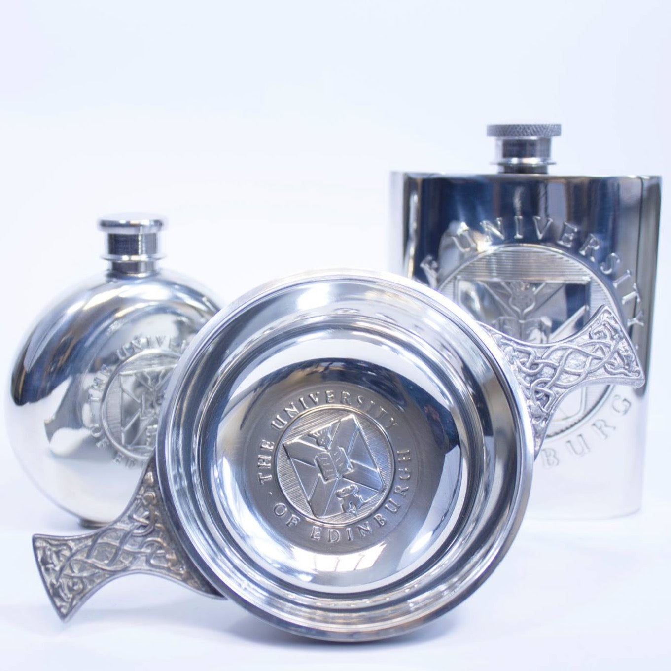 The items in the pewter gift range - round pewter hipflask on the left, quaich in the middle and square hipflask on the right 