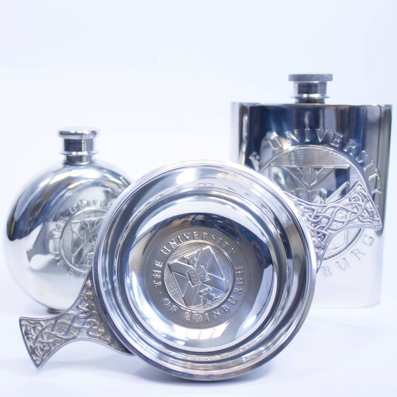 A collection of our pewter gifts including the Round Petwer Hip Flask, the Quaich and the Square Pewter Hip Flask.  