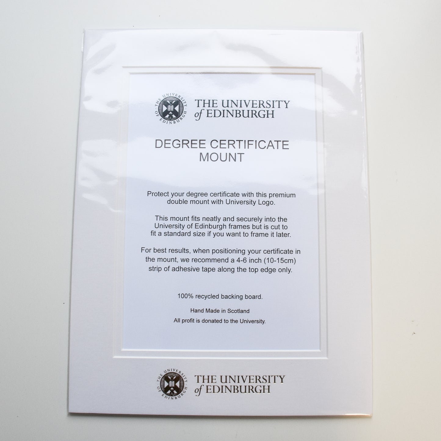 Degree certificate mount with gold foil logo detailing 